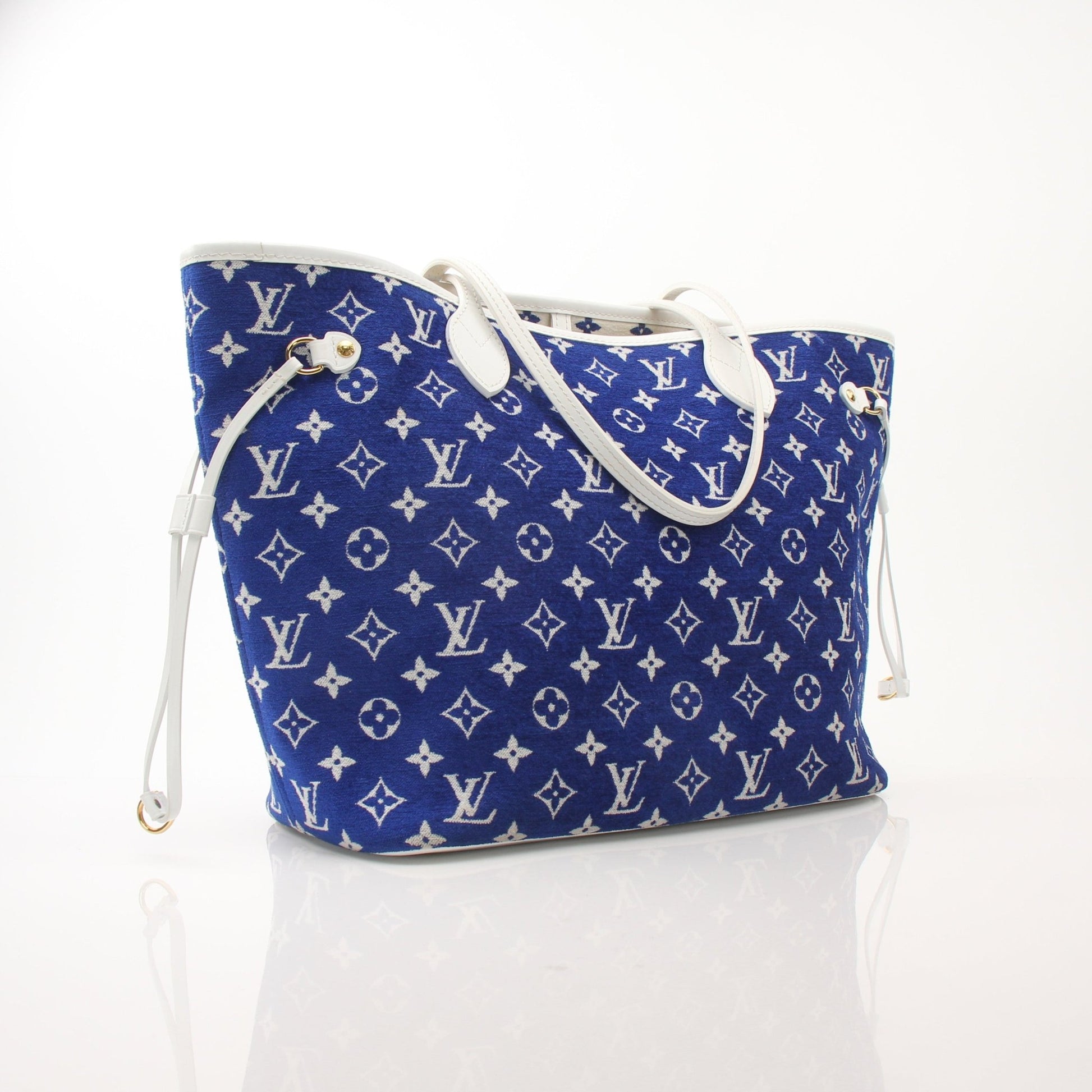 Louis Vuitton LV Match Neverfull MM handbag in beige canvas with leather trim, featuring silver hardware and side pockets.