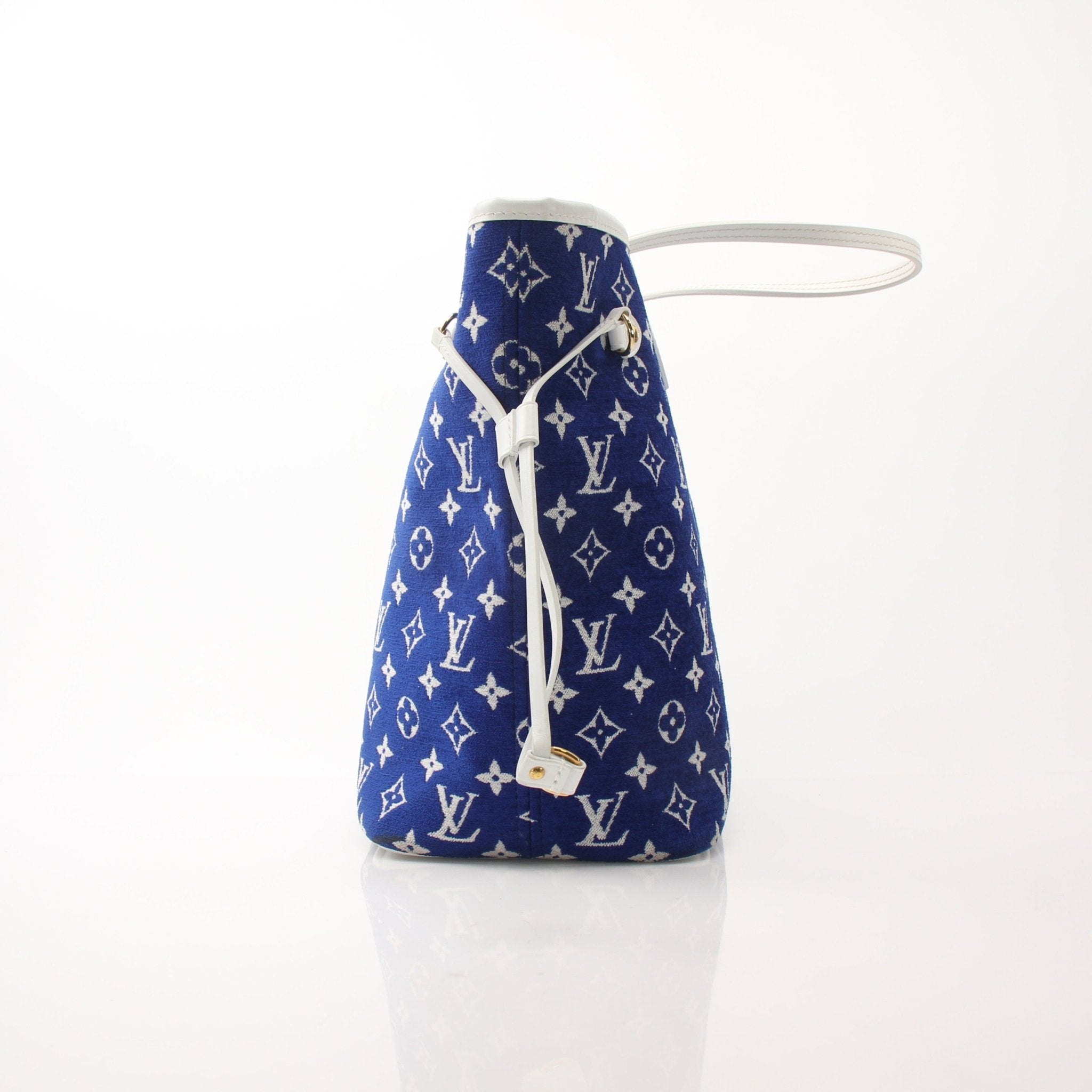 Louis Vuitton LV Match Neverfull MM handbag in beige with leather trim, displayed on a plain background.