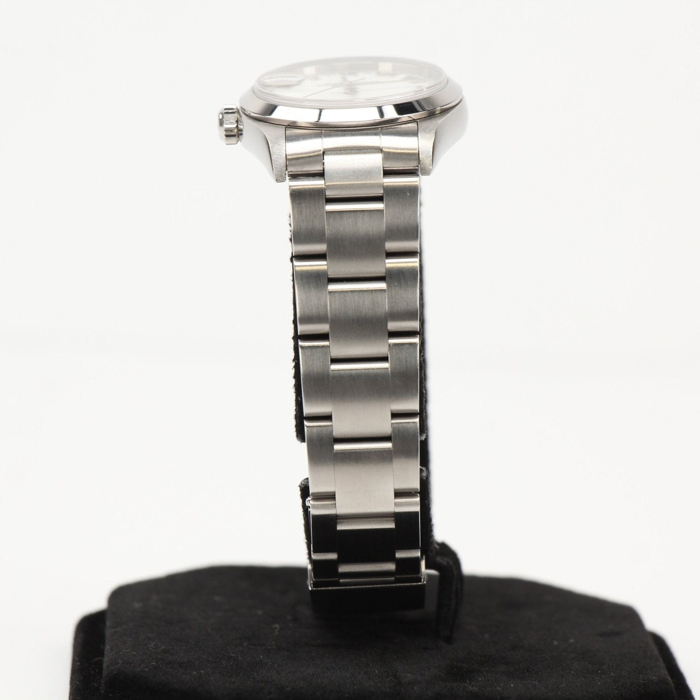 Rolex Datejust watch with gold bezel and bracelet, featuring a classic dial and date display, by Gold & Beyond.