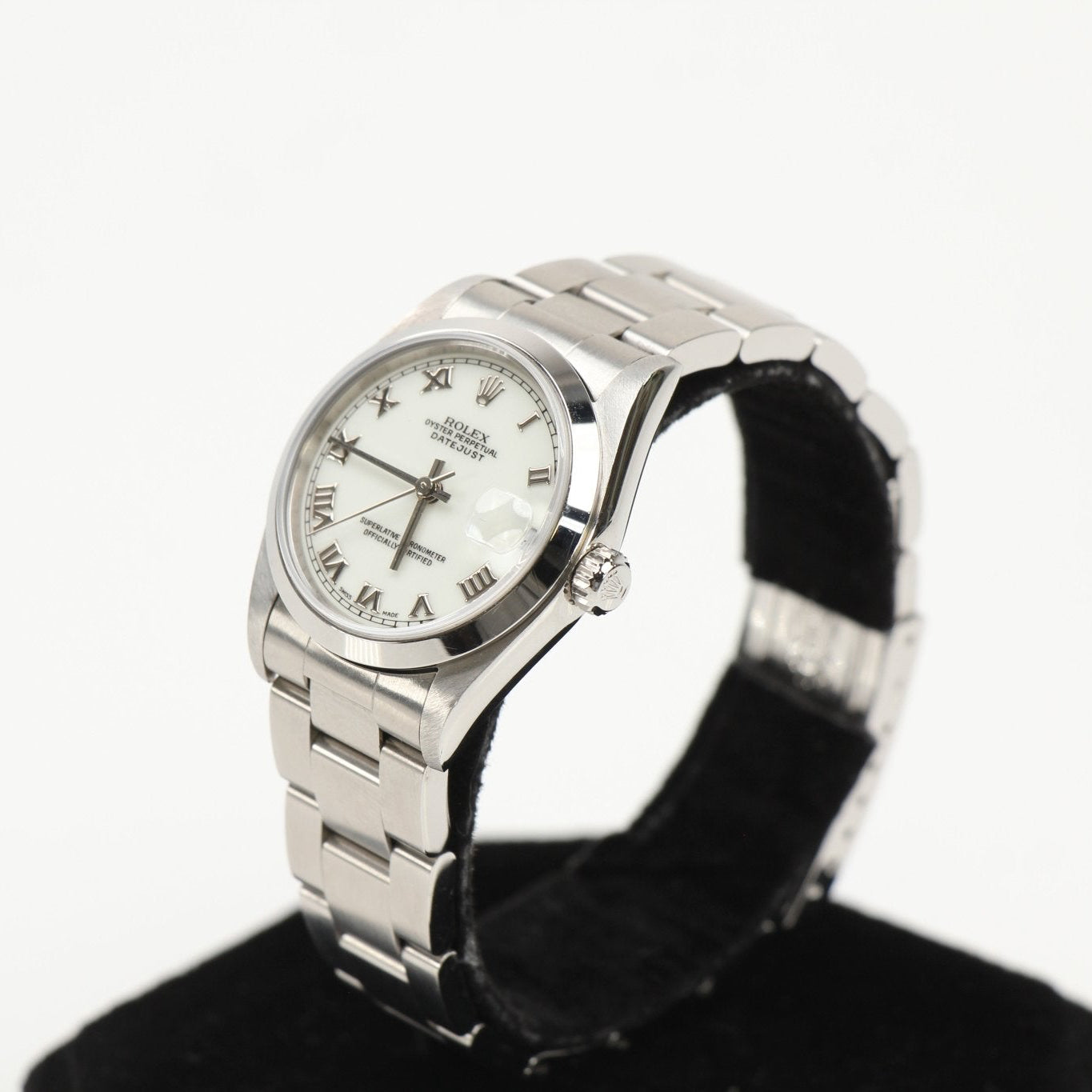 Rolex Datejust gold and stainless steel watch with a silver dial and fluted bezel, showcasing a classic luxury timepiece.