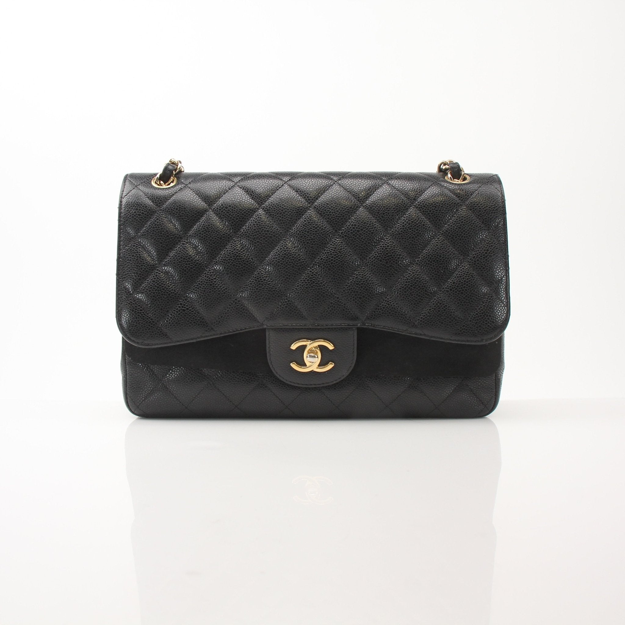 Gold & Beyond Chanel large classic black leather flap shoulder handbag with gold chain strap and signature quilting.