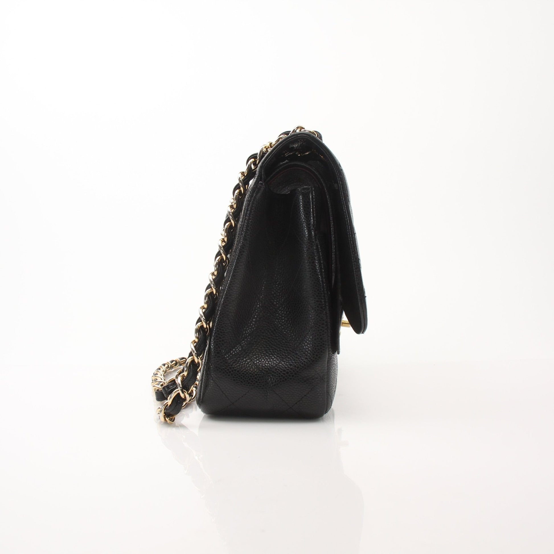 Gold & Beyond Chanel large classic black flap shoulder handbag with gold hardware and quilted leather design.
