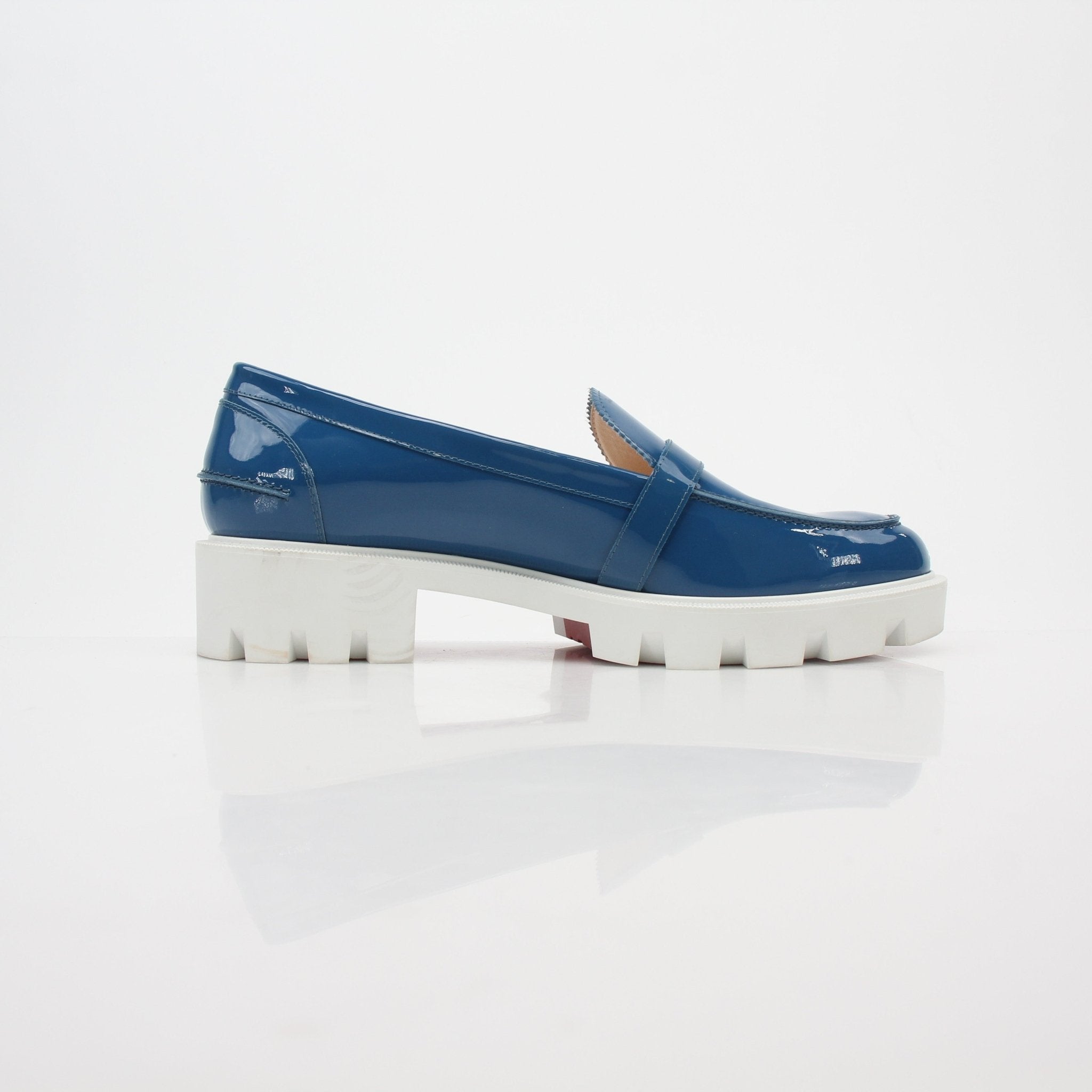 Christian Louboutin Blue Lock Woody patent leather loafers with sleek design and signature red sole detail.