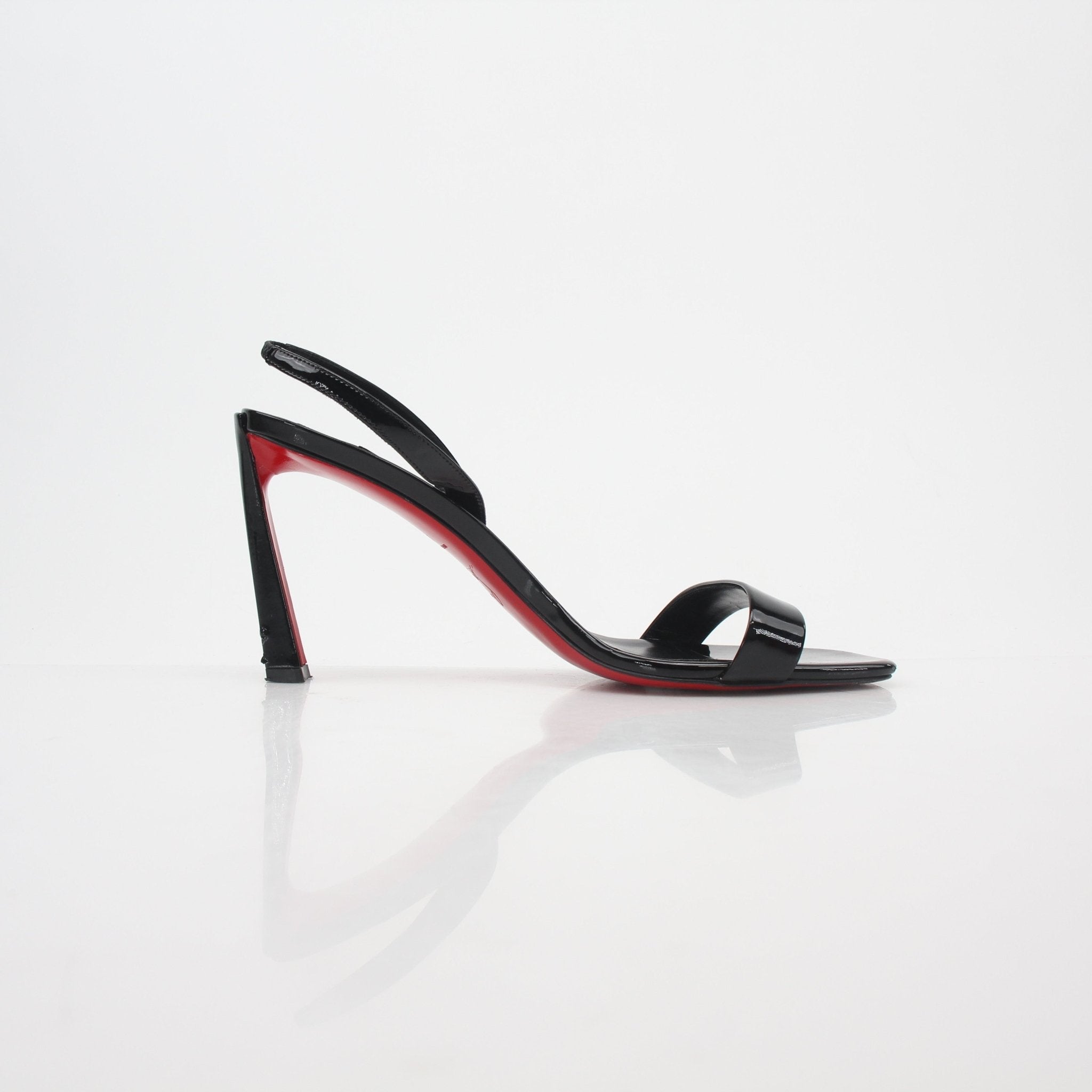Christian Louboutin Black Condora Queen patent leather sandals with stiletto heels and signature red soles, stylish and luxurious heels.