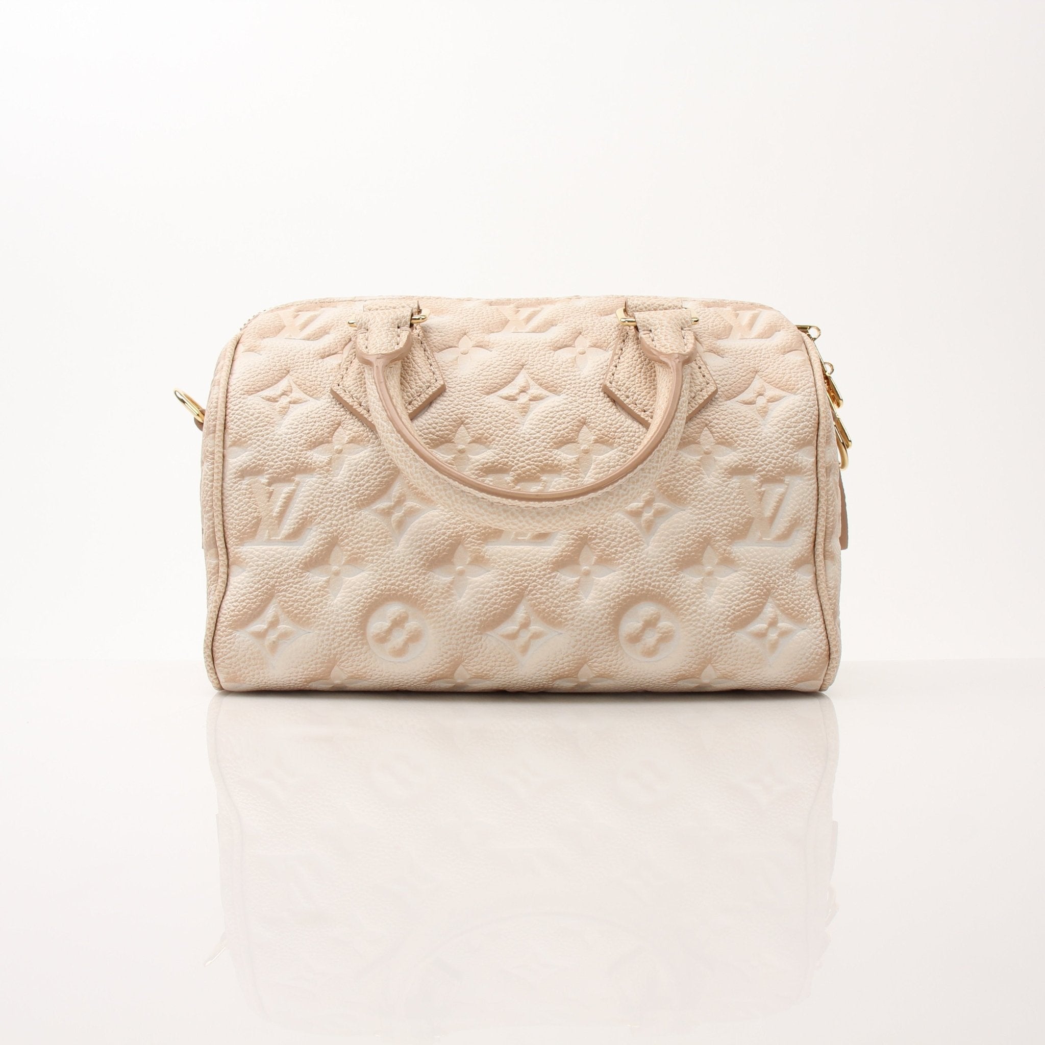Louis Vuitton Speedy Bandoulière handbag with leather handles and signature monogram canvas, gold-tone hardware, and adjustable strap.