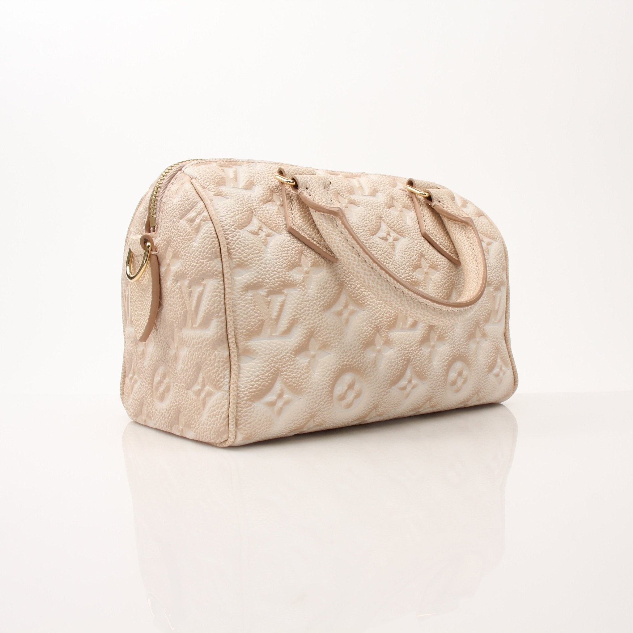 Louis Vuitton Speedy Bandoulière handbag with gold hardware and monogram canvas, featuring a top handle and adjustable shoulder strap.