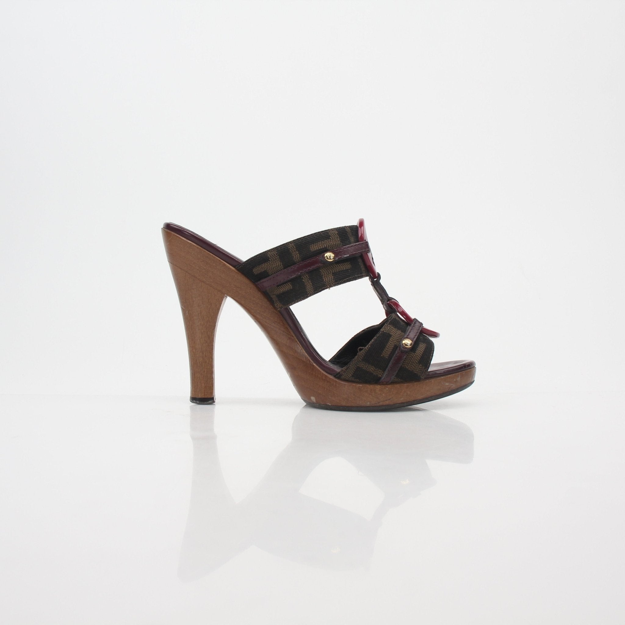 Fendi brown Zucca canvas platform sandals with heels, featuring Fendi's signature pattern and stylish design.