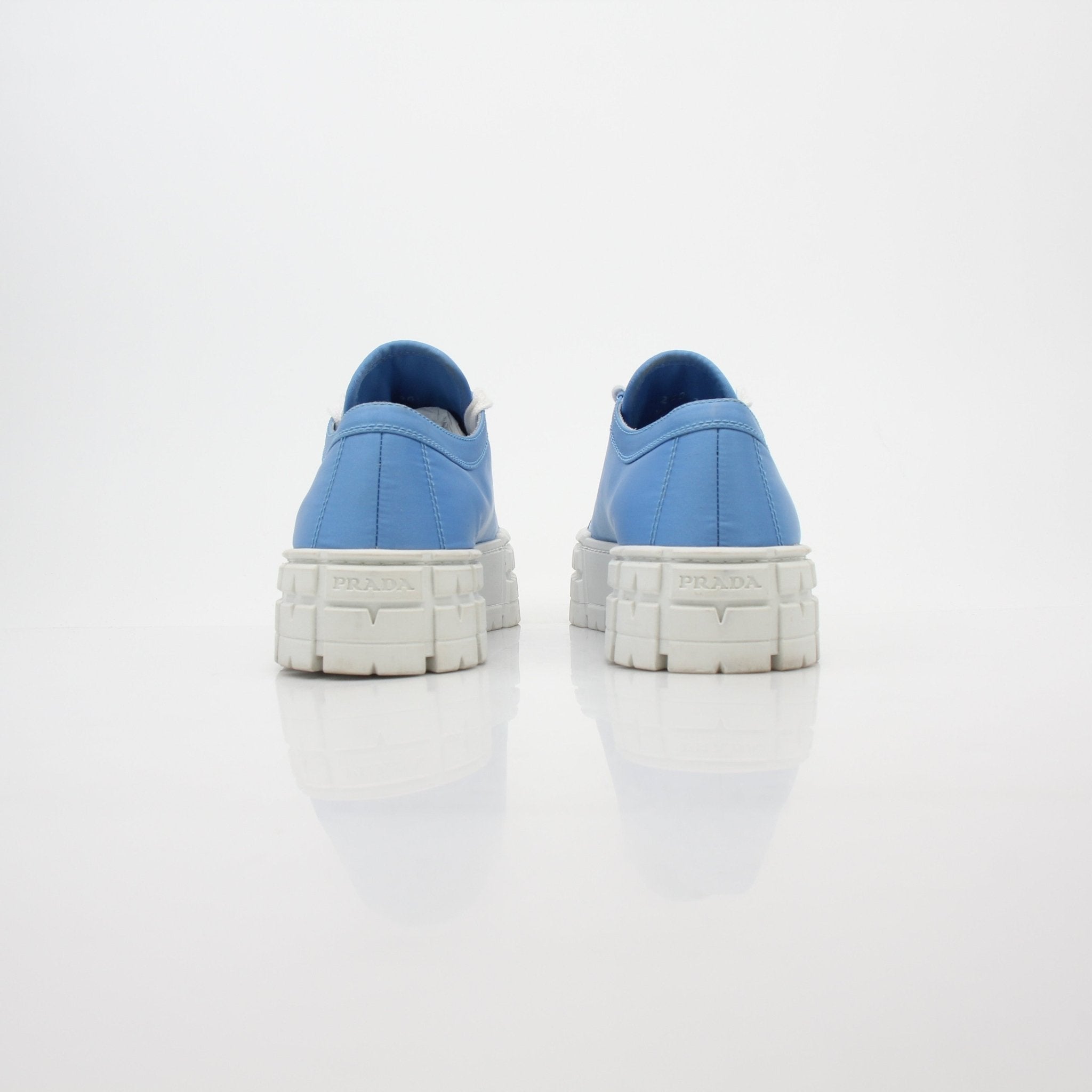 Gold & Beyond Prada light blue double wheel low top sneakers with white soles, casual shoes for everyday wear