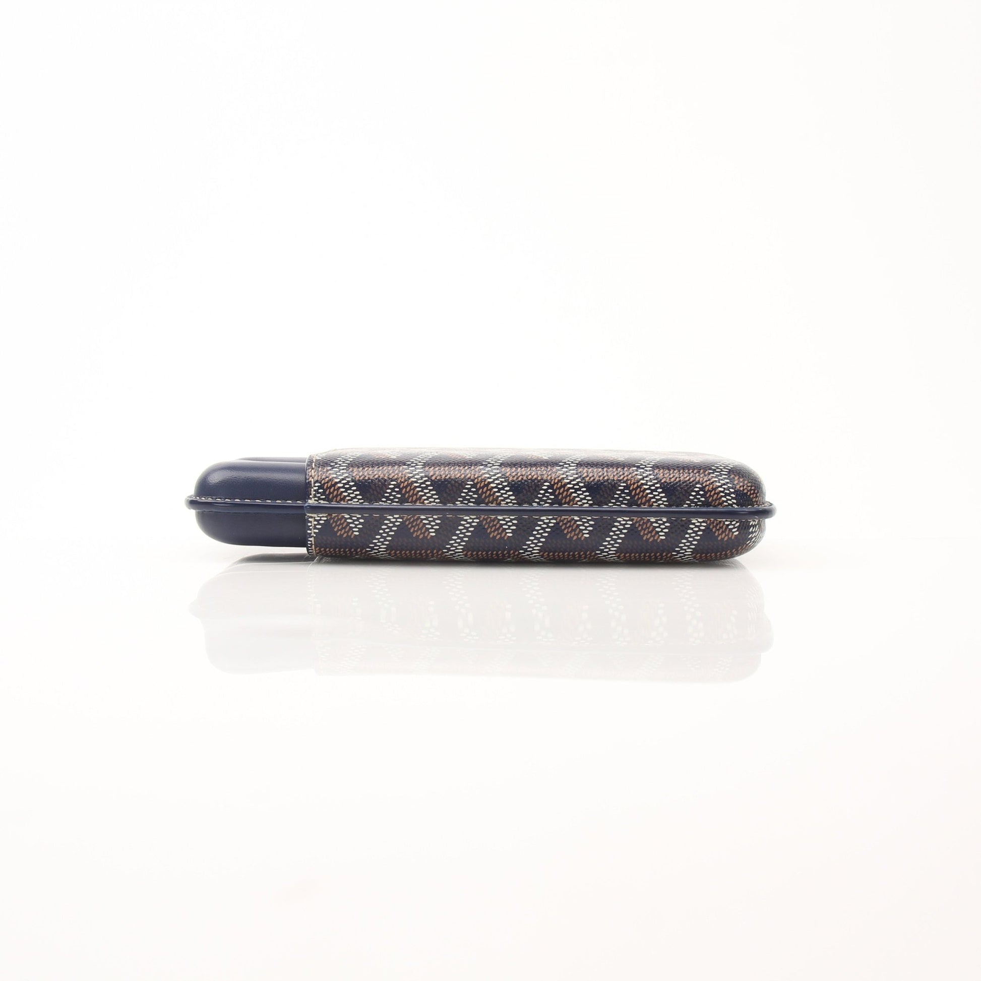 Small navy Goyard Churchill cigar case from Goyardine fabric, designed as a compact accessory with gold accents.
