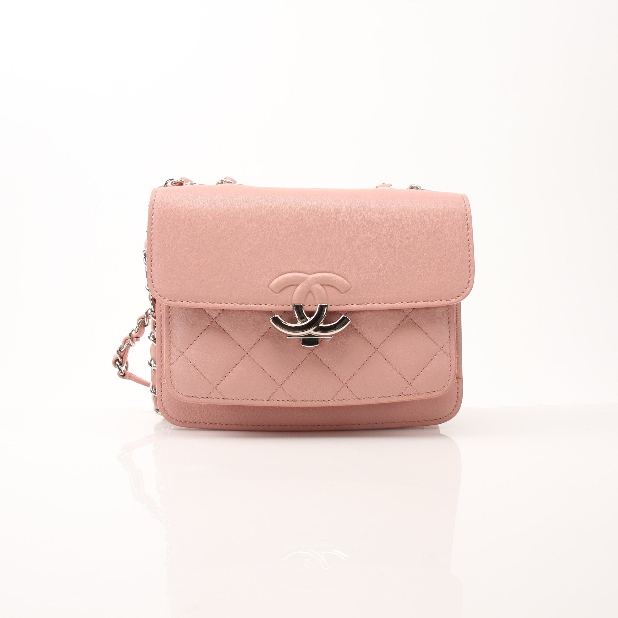 Chanel pink CC box flap shoulder handbag with gold chain strap and classic quilting detail.