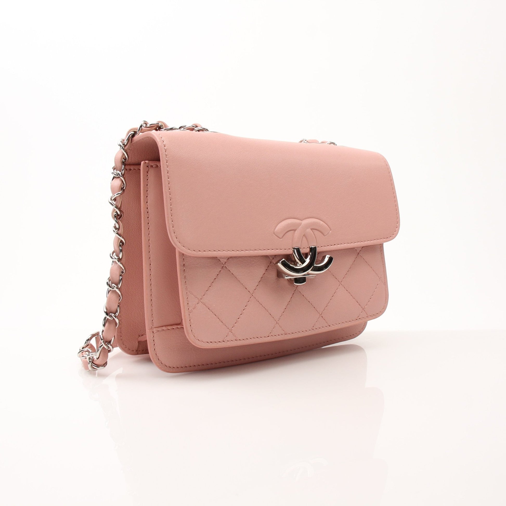 Chanel pink CC box flap shoulder handbag with gold hardware, featuring a stylish leather design and chain strap.