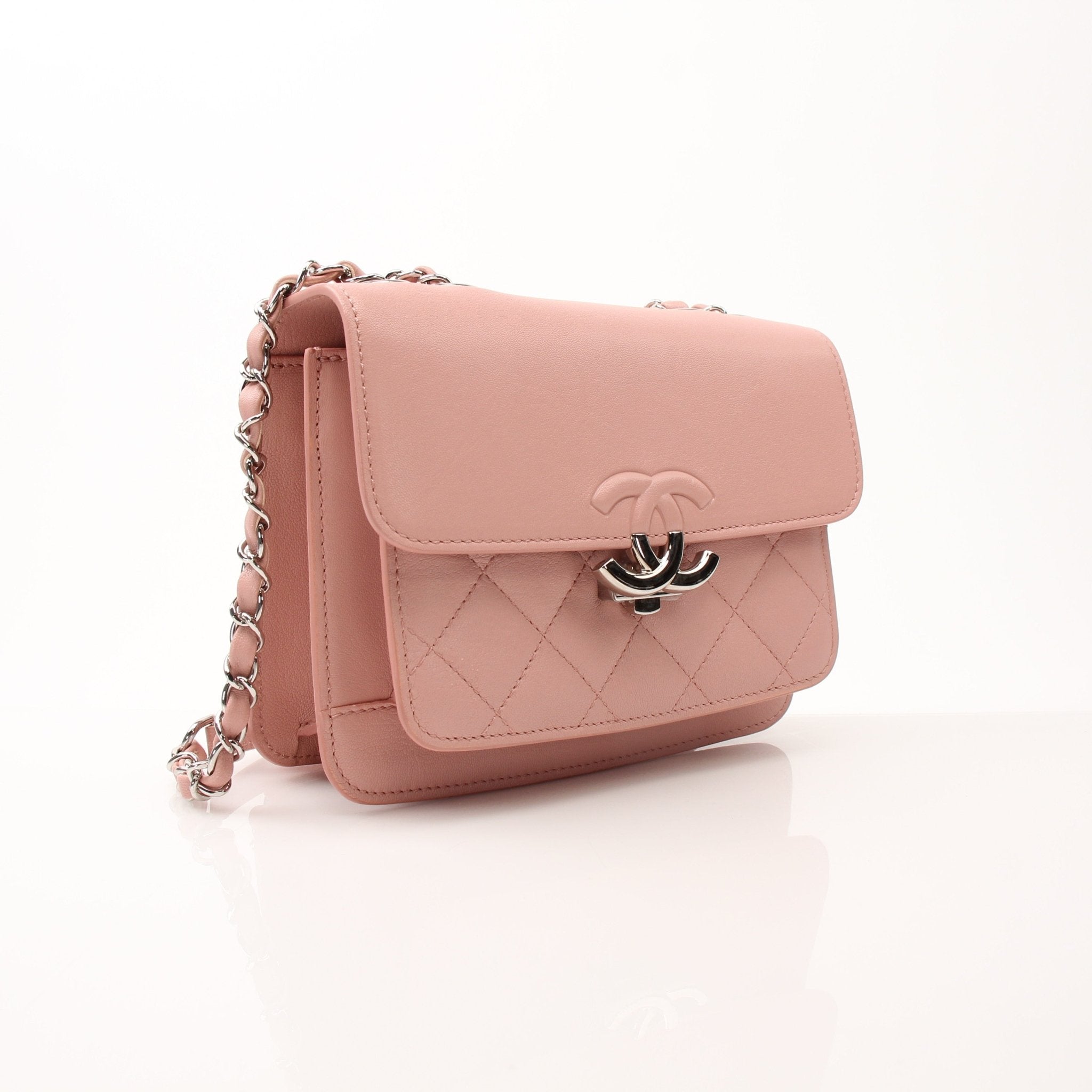 Chanel pink CC box flap shoulder handbag with gold hardware, featuring a stylish leather design and chain strap.