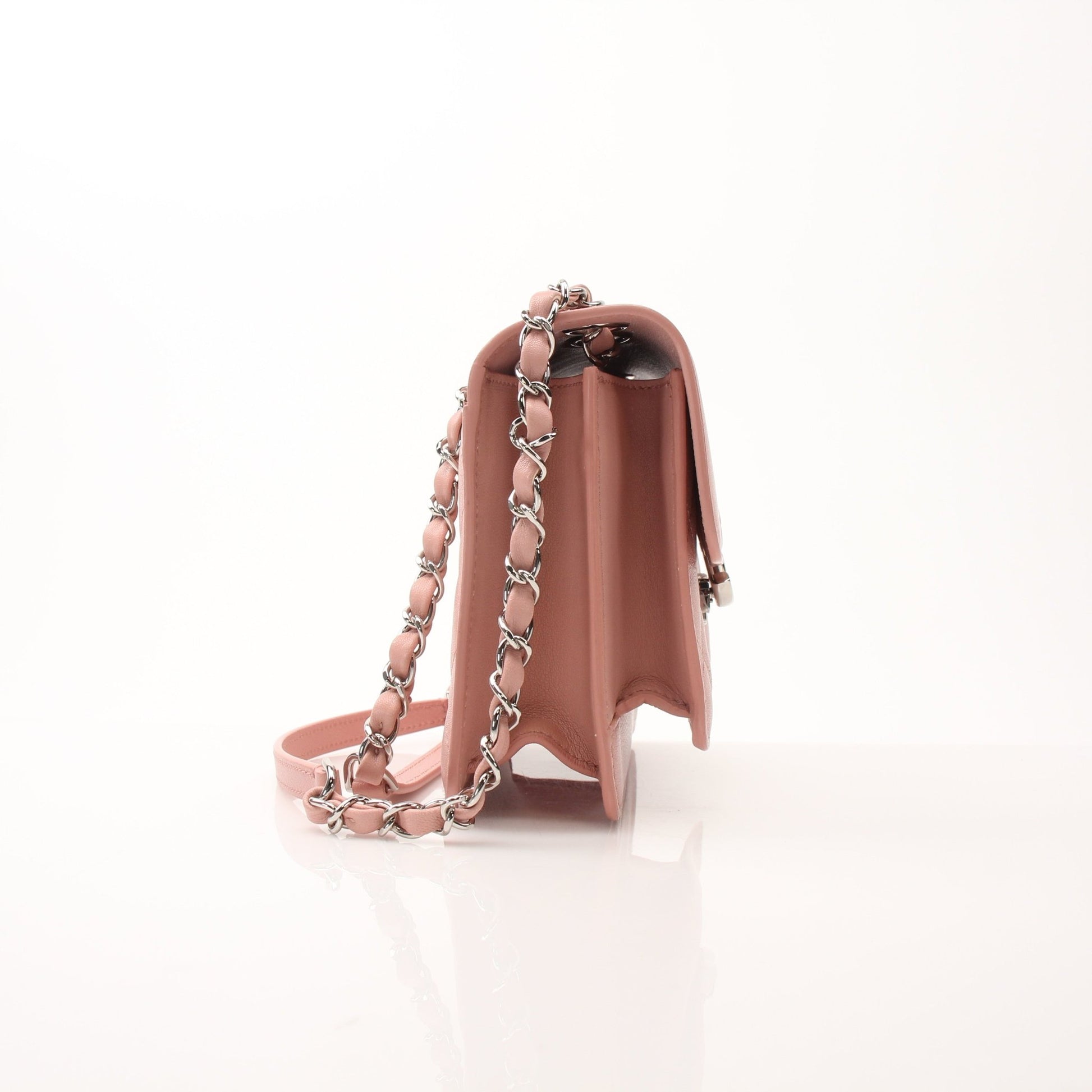 Chanel pink CC box flap shoulder handbag with gold accents and chain strap, featuring quilted leather and signature logo.