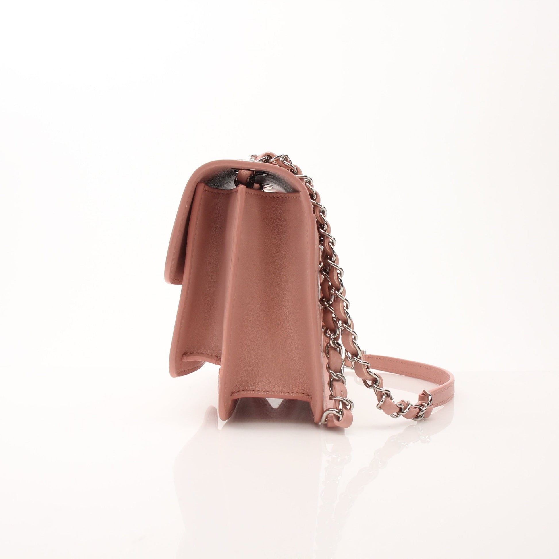 Chanel pink CC box flap shoulder handbag with gold hardware, featuring a classic quilted design and chain strap.