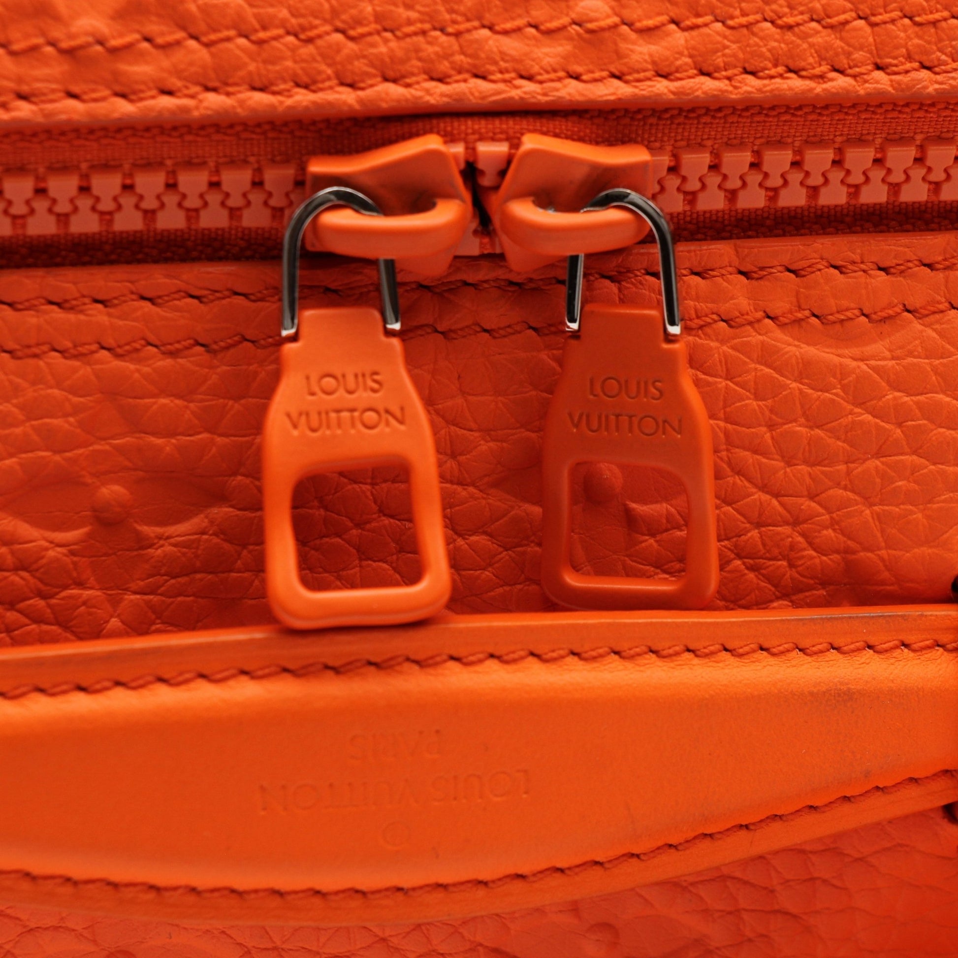 Louis Vuitton Christopher PM backpack in travel bag style with leather straps and monogram canvas, displayed on a neutral background.