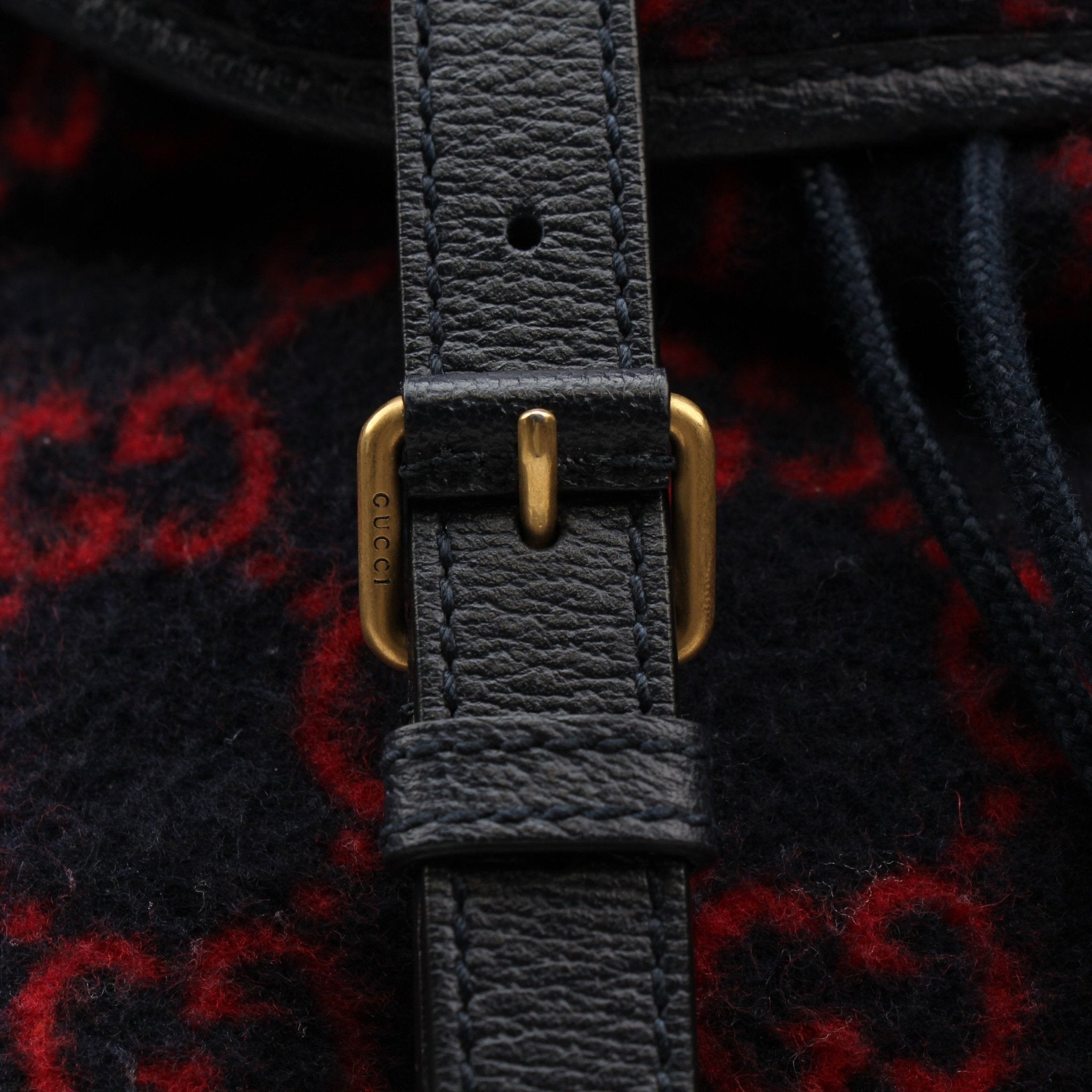 Gold & Beyond Gucci GG Monogram Backpack handbag with adjustable straps and gold-tone hardware, featuring iconic monogram design.
