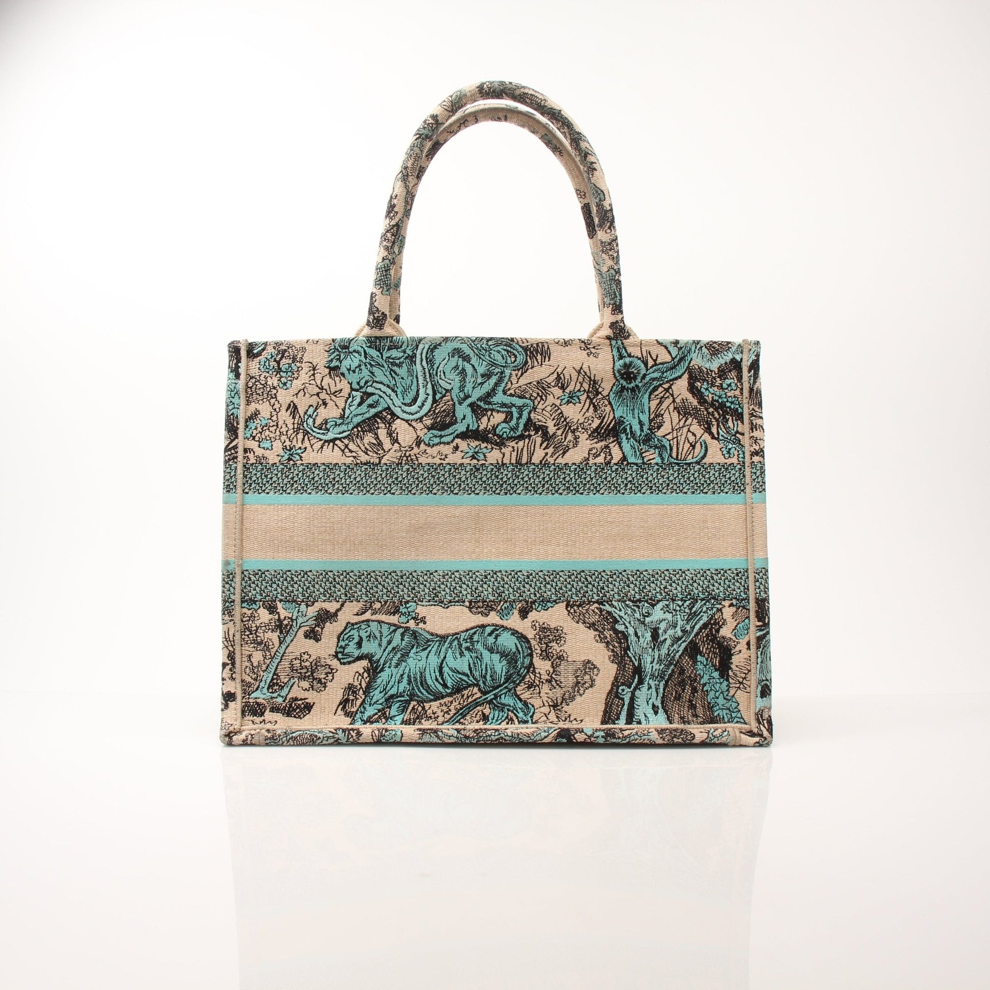 Christian Dior Book Tote handbag in beige with floral pattern, featuring leather handles and gold-tone hardware.