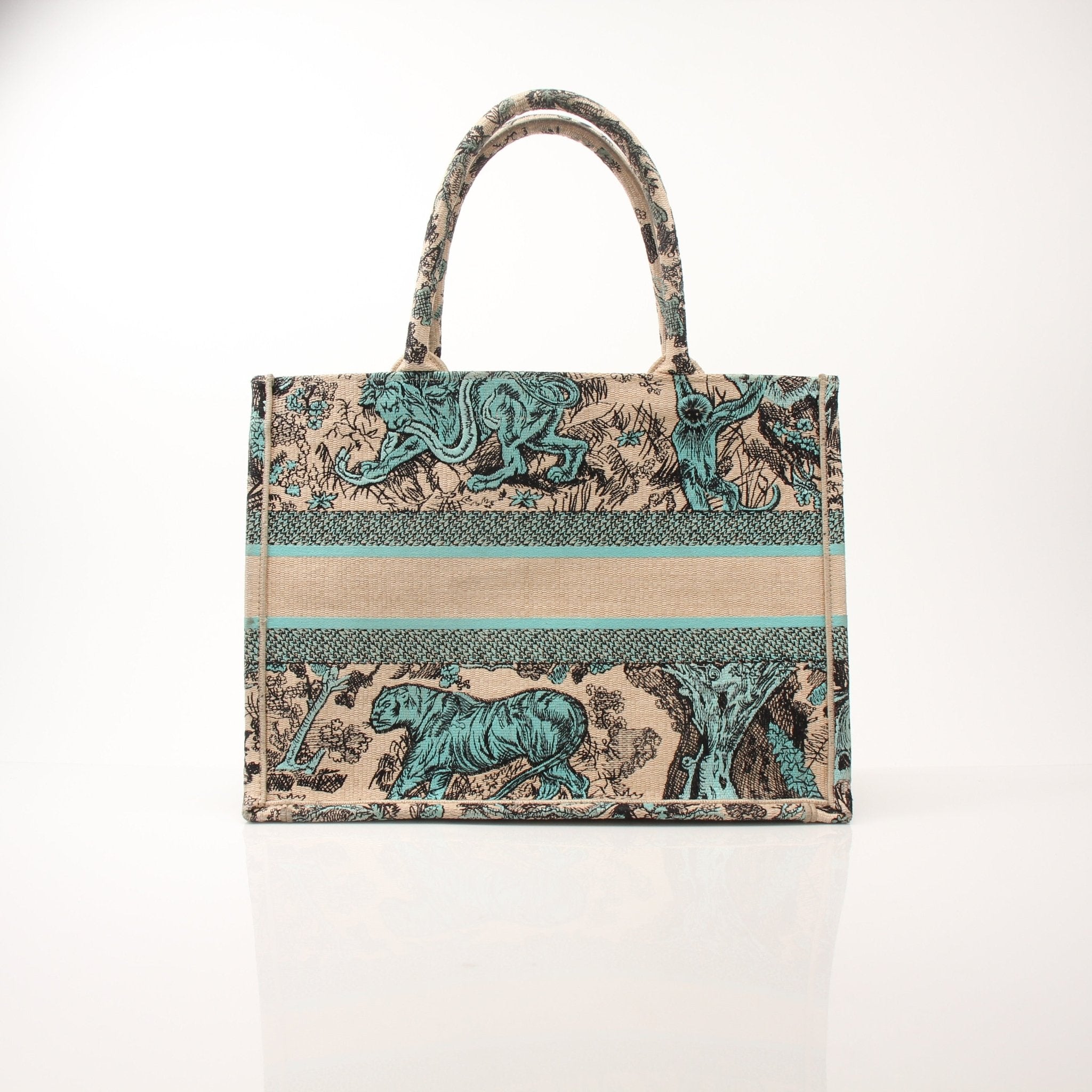 Christian Dior Book Tote handbag in beige with floral pattern, featuring leather handles and gold-tone hardware.