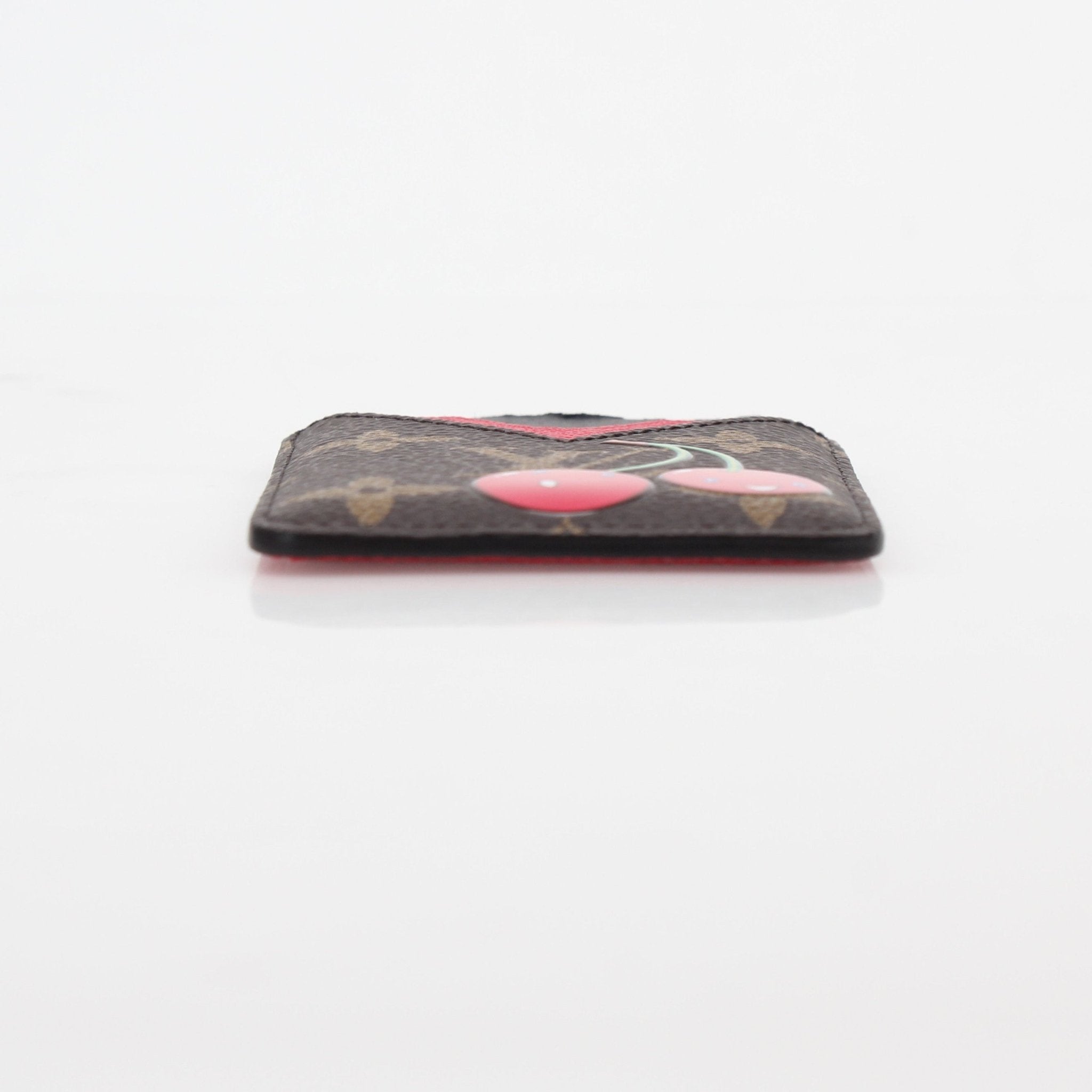 Louis Vuitton x Takashi Murakami Cherry Porte-Cartes magnet card holder with colorful floral design, compact and stylish accessory.