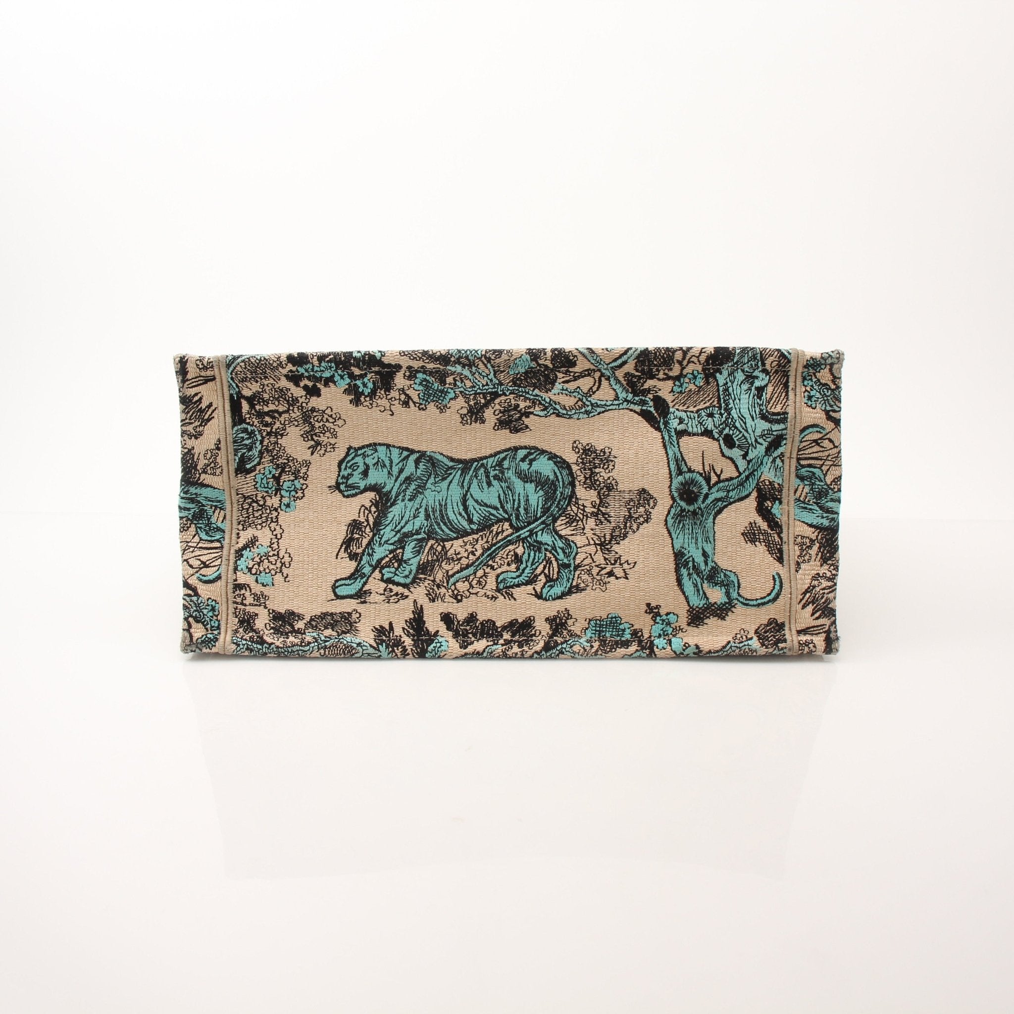 Christian Dior Book Tote handbag by Gold & Beyond, showing the signature patterned fabric and structured leather handles.