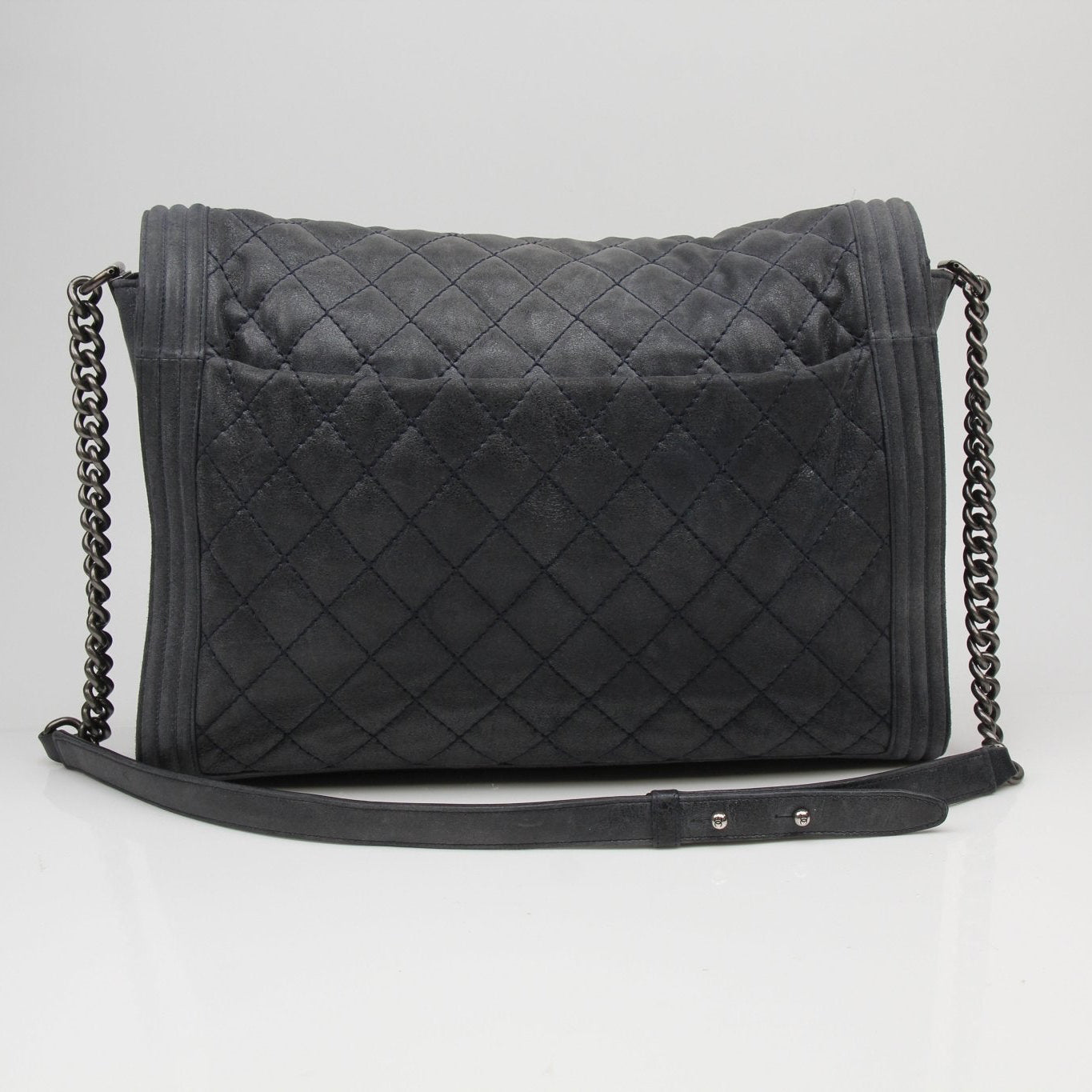 Chanel charcoal large quilted soft boy handbag with gold hardware and chain strap, stylish and luxurious accessory.