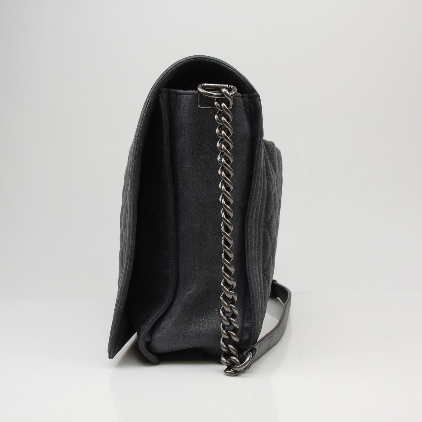 Chanel Charcoal large quilted soft boy handbag with gold chain strap and logo detailing, stylish and elegant accessory.
