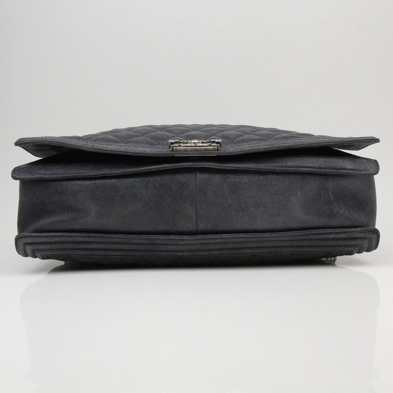 Gold & Beyond Chanel Charcoal Large Quilted Soft Boy Handbag with gold chain strap and signature quilting detail.