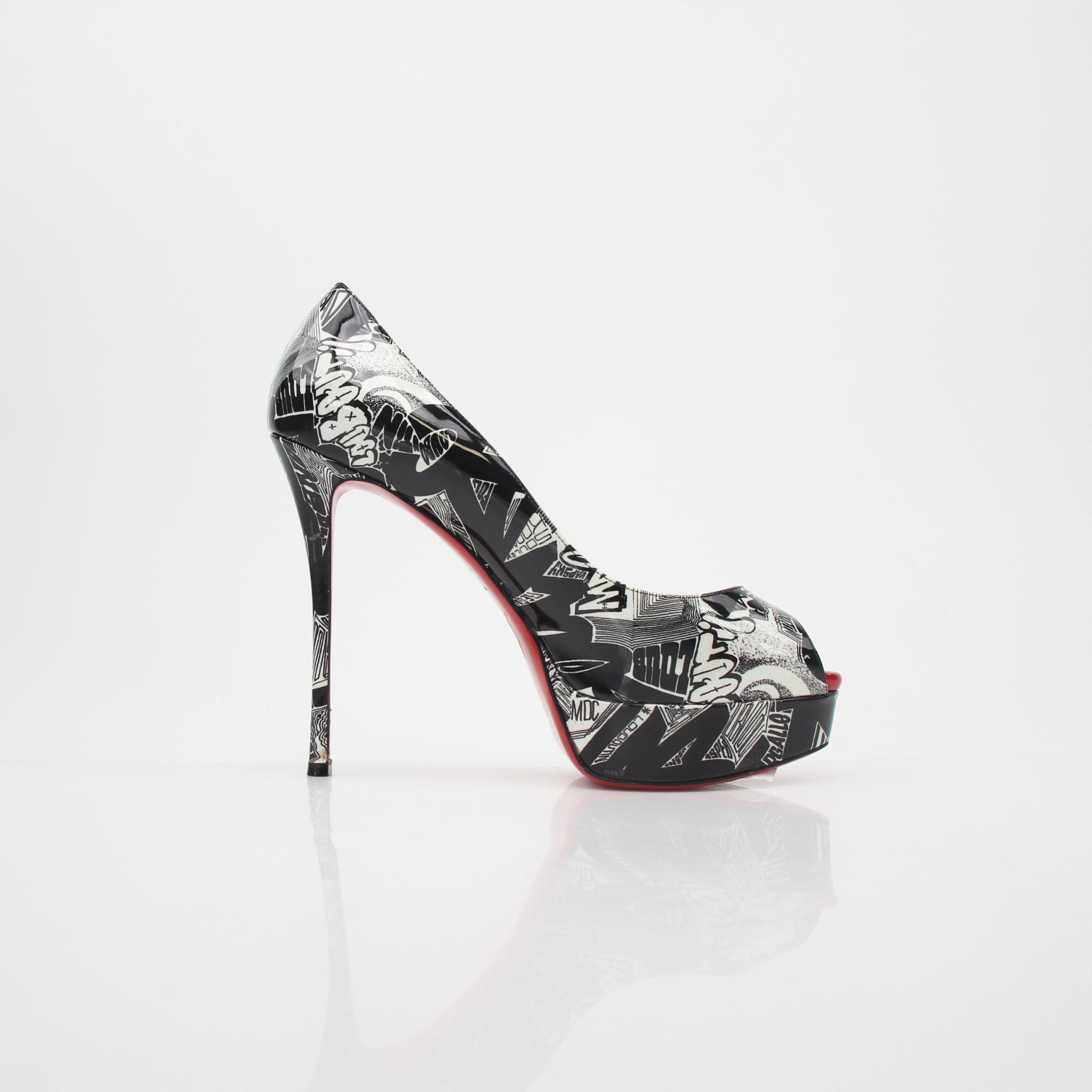 Christian Louboutin black and white printed fetish peep platform heels with bold design and high stiletto heels.