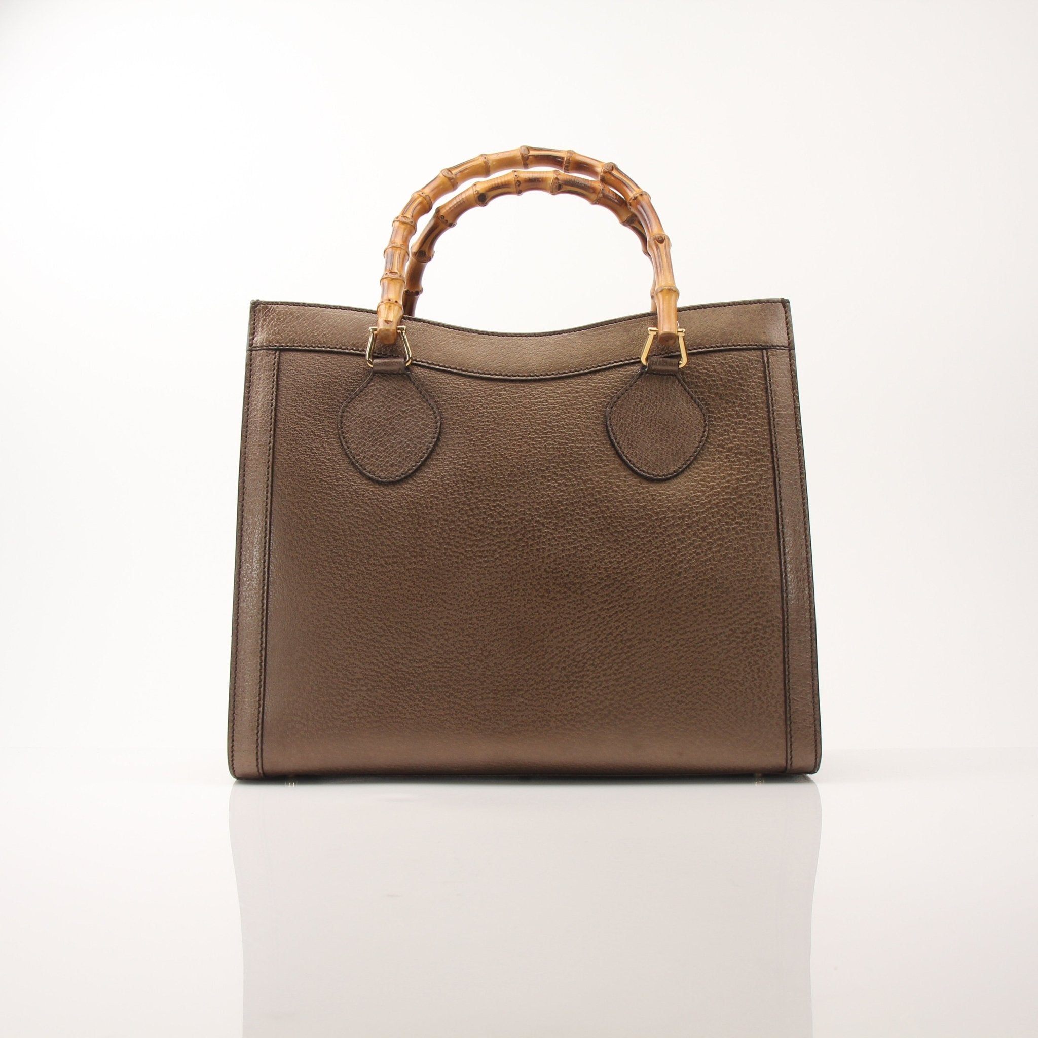Gold & Beyond Gucci Bamboo Tote handbag featuring woven bamboo handles and a spacious interior for everyday use.