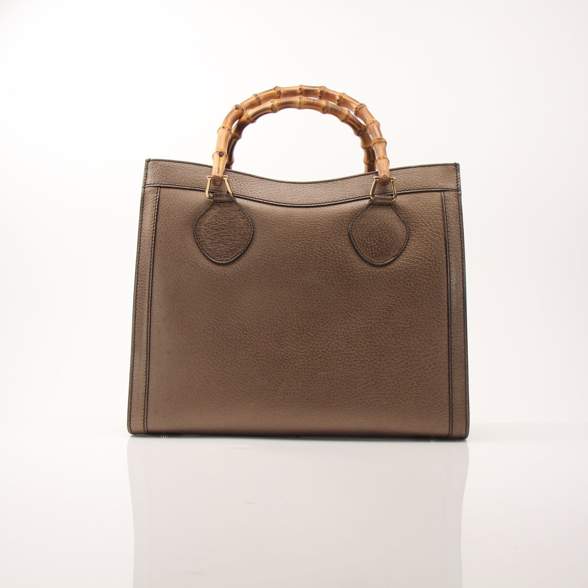 Gold & Beyond Gucci Bamboo Tote handbag with woven bamboo handles and classic design, shown on a plain background.