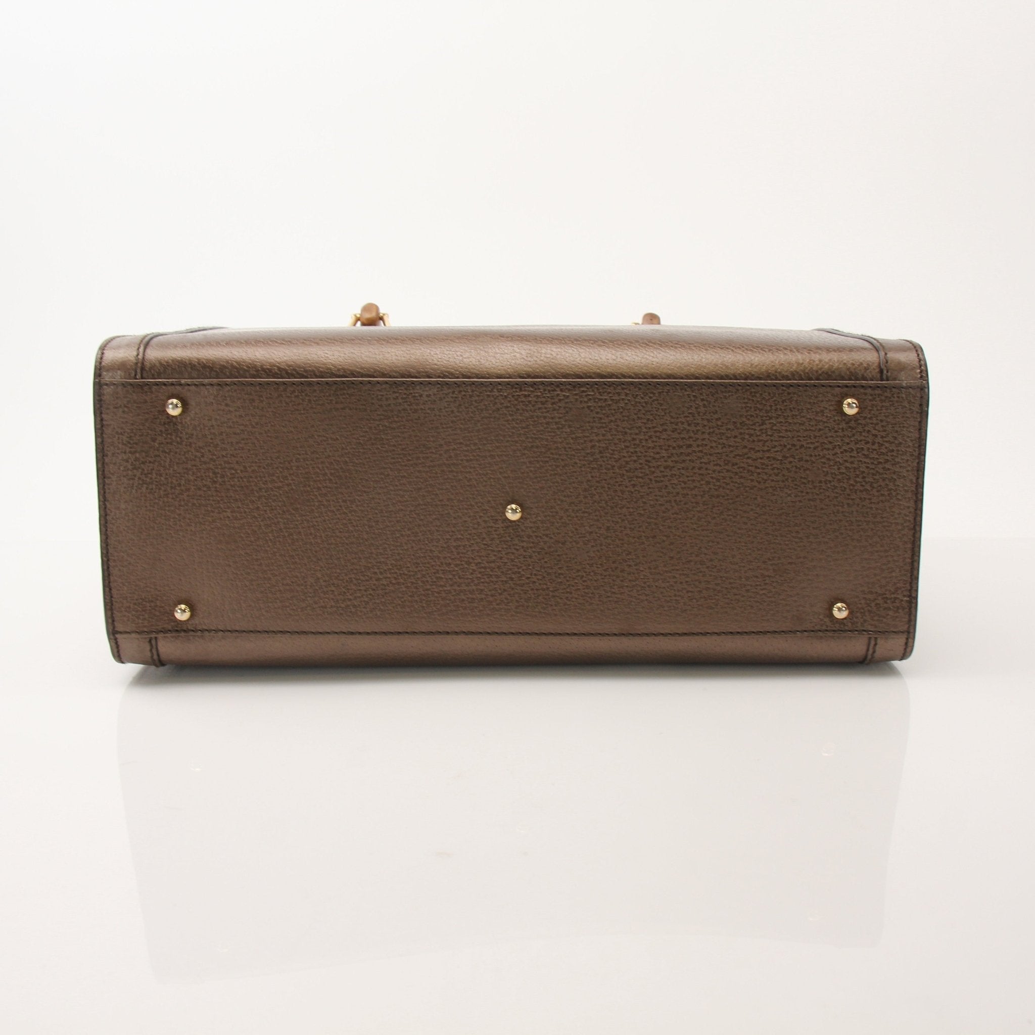 Gold & Beyond Gucci Bamboo Tote handbag featuring structured design, beige woven bamboo exterior, and leather accents.