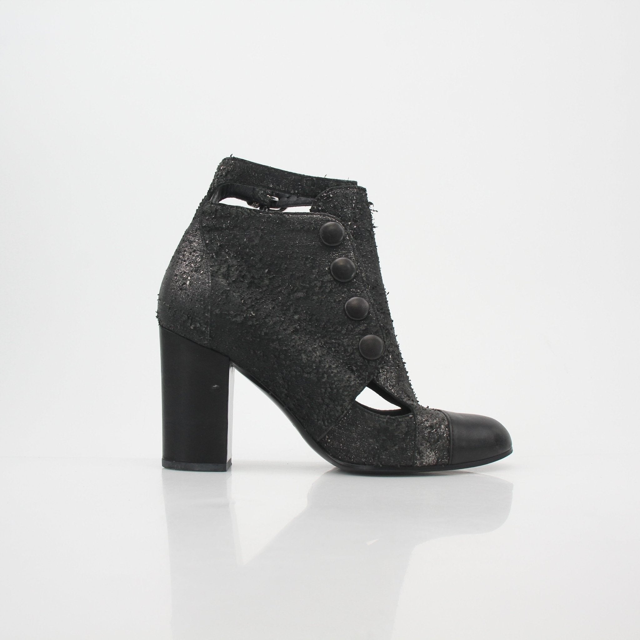 Gold & Beyond Chanel black distressed cutout ankle boots, stylish shoes with edgy design and ankle height detail.