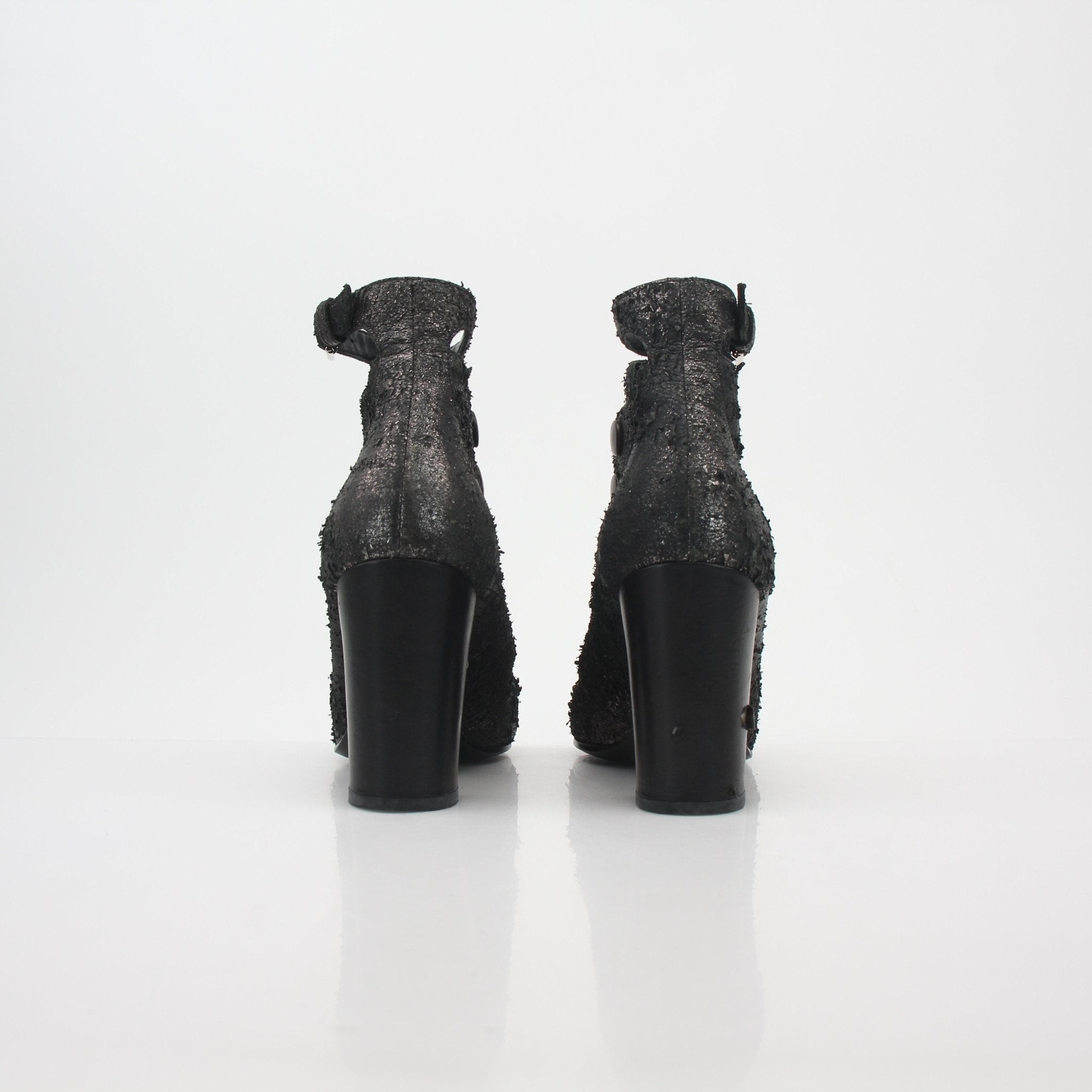 Gold & Beyond black distressed cutout ankle boots with chunky heels and stylish design, perfect for a fashionable look.