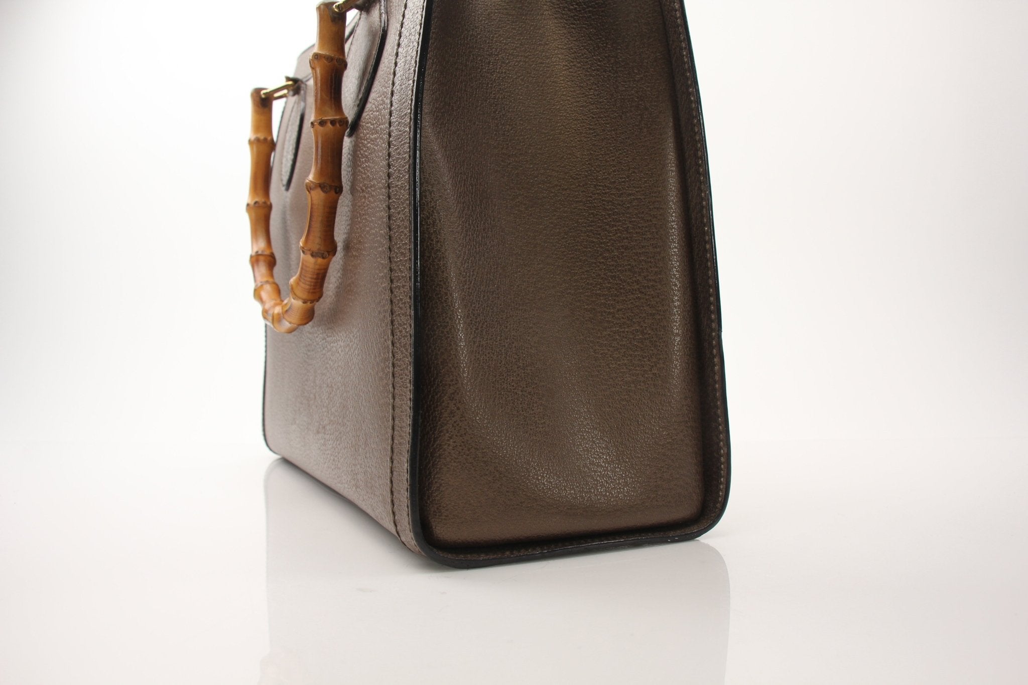 Gold & Beyond Gucci Bamboo Tote handbag with structured design and bamboo handles, displayed on a neutral background.