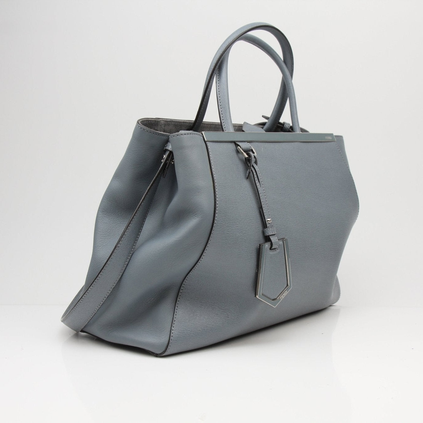 Fendi 2Jours medium textured leather tote handbag in a stylish design, featuring dual handles and a spacious interior.