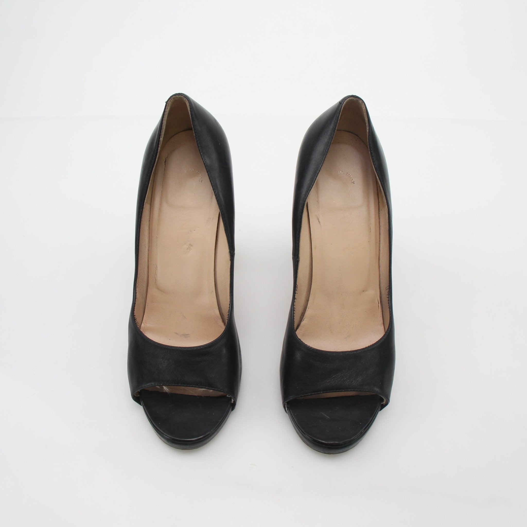 Gold & Beyond Chanel black leather cork heel peep-toe pumps with stylish design and elegant heel detail.