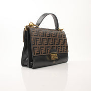 Gold & Beyond Fendi FF Kan shoulder handbag with logo pattern and top handle, stylish accessory on a neutral background.