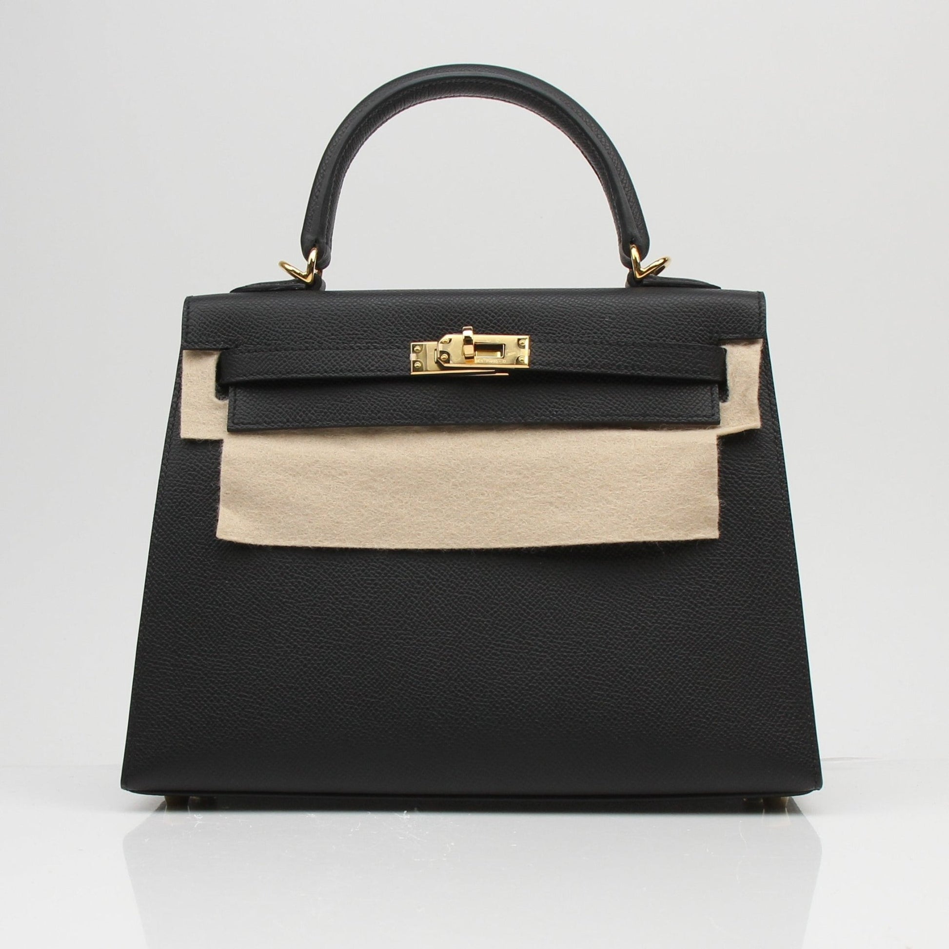 Hermès Kelly 25 Sellier handbag in luxury leather with gold hardware, displayed on a neutral background.