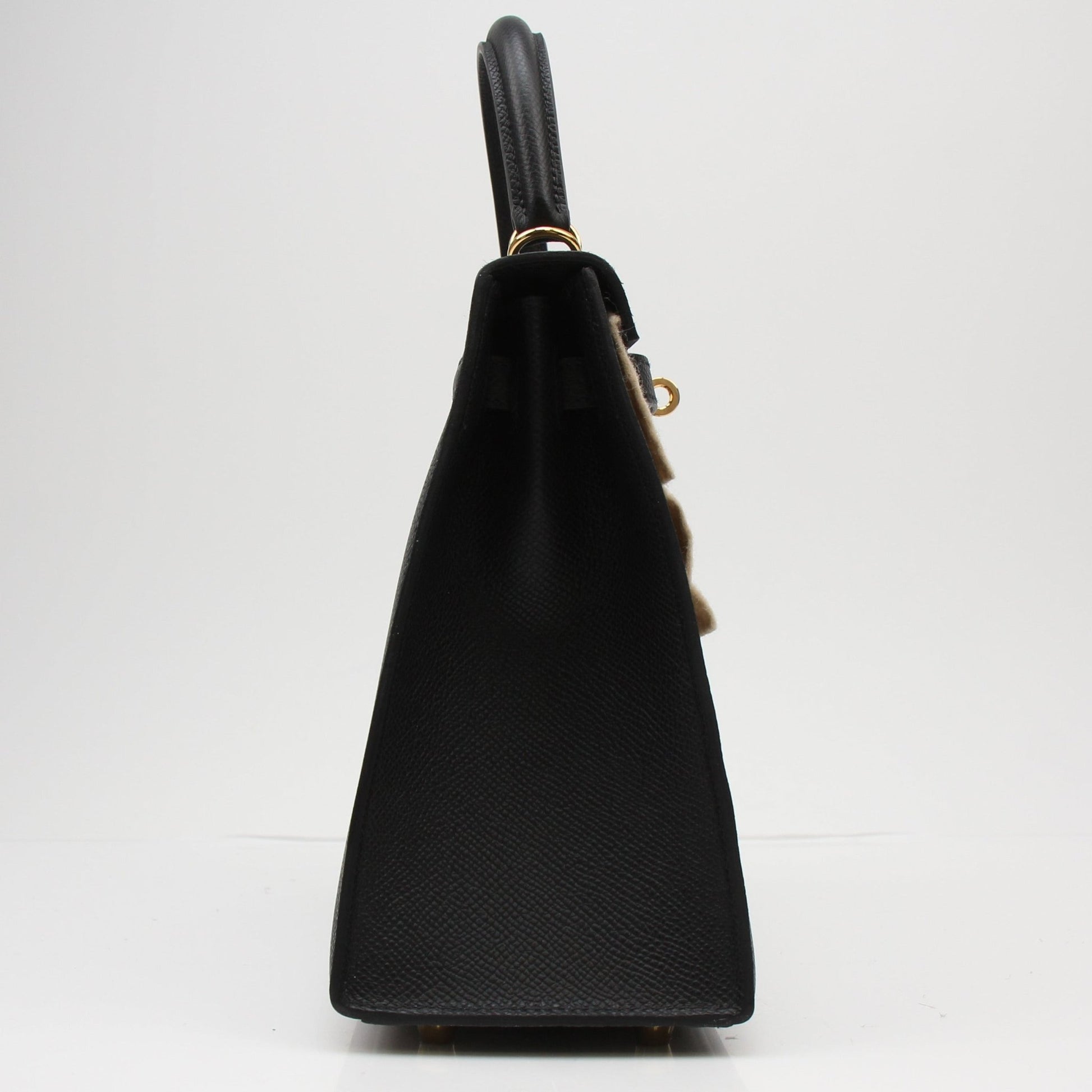 Hermès Kelly 25 Sellier handbag in leather, featuring structured design and gold hardware, by Gold & Beyond.