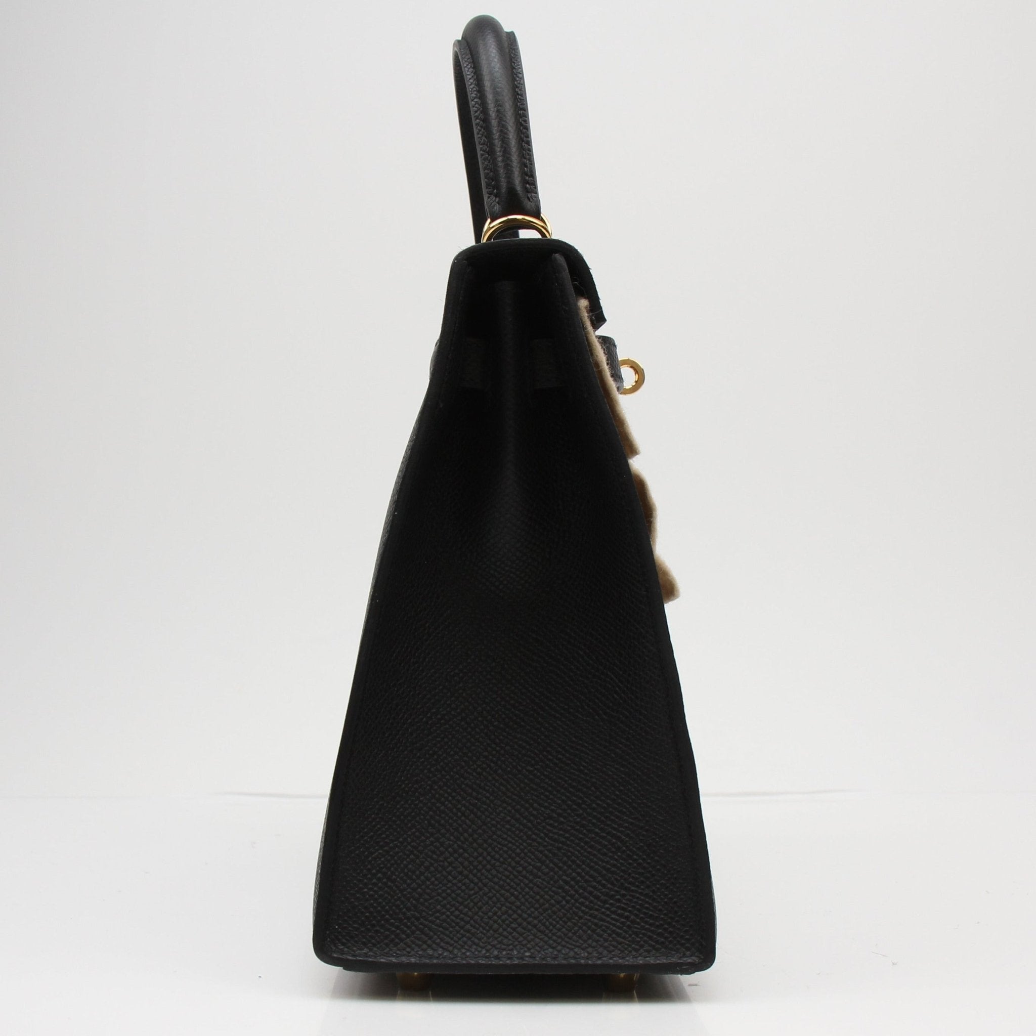 Hermès Kelly 25 Sellier handbag in leather, featuring structured design and gold hardware, by Gold & Beyond.