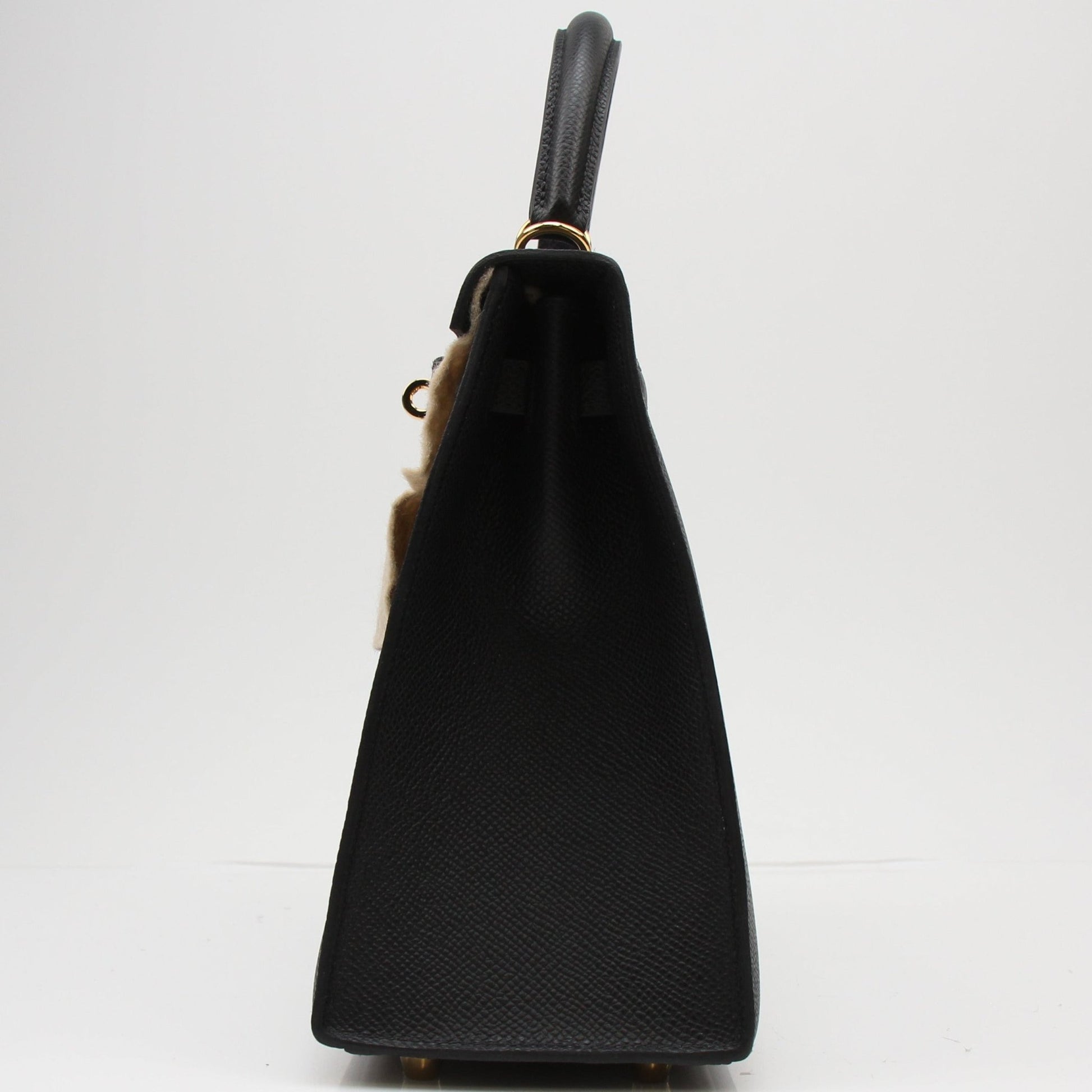 Hermès Kelly 25 Sellier handbag in luxurious leather, featuring structured design and gold hardware by Gold & Beyond.