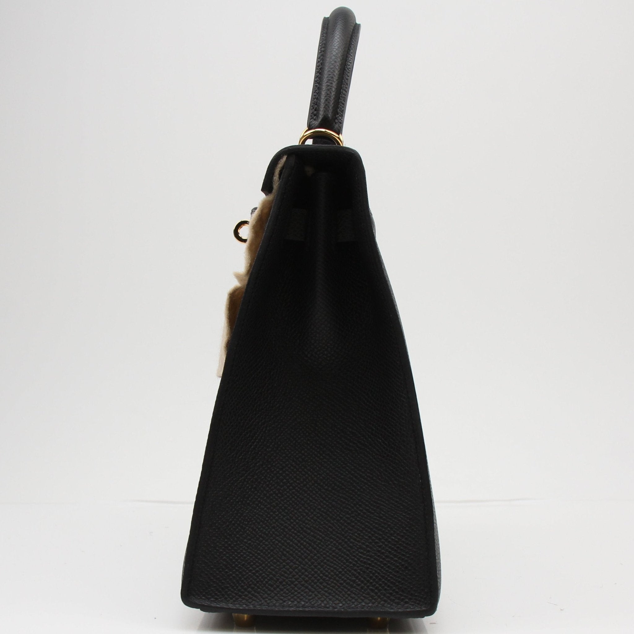 Hermès Kelly 25 Sellier handbag in luxurious leather, featuring structured design and gold hardware by Gold & Beyond.