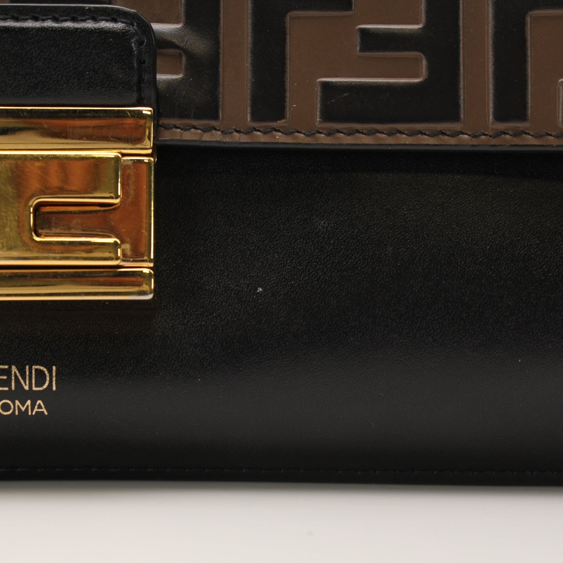 Fendi FF Kan shoulder handbag with gold chain strap, black leather and signature logo design.