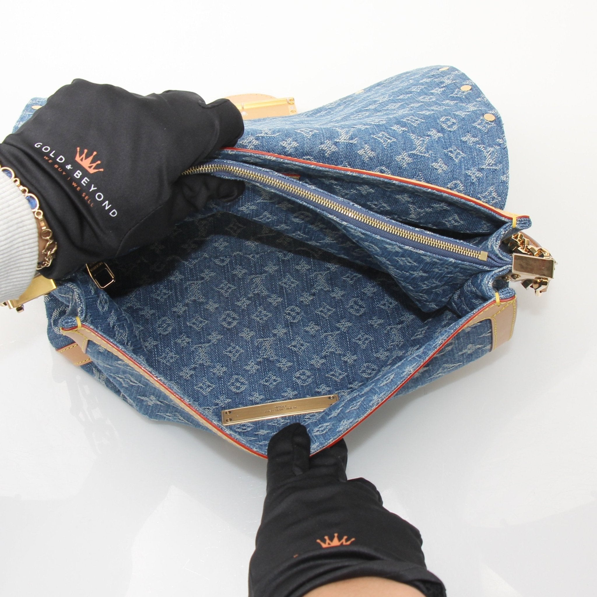 Gold & Beyond Louis Vuitton Dauphine GM handbag with structured silhouette, gold hardware, and adjustable shoulder strap.