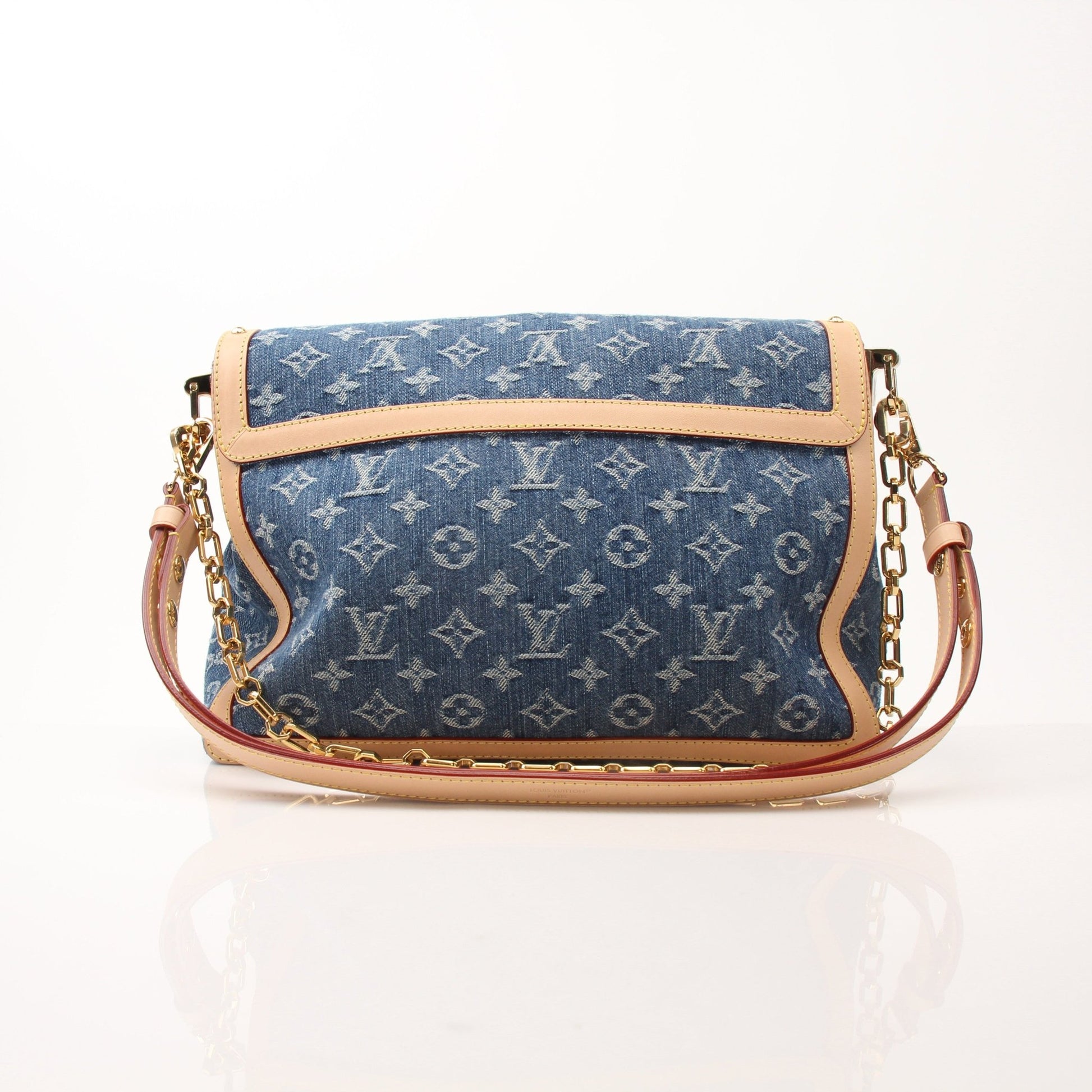 Gold & Beyond Louis Vuitton Dauphine GM shoulder handbag with leather and monogram canvas, featuring a top handle and gold-tone hardware.