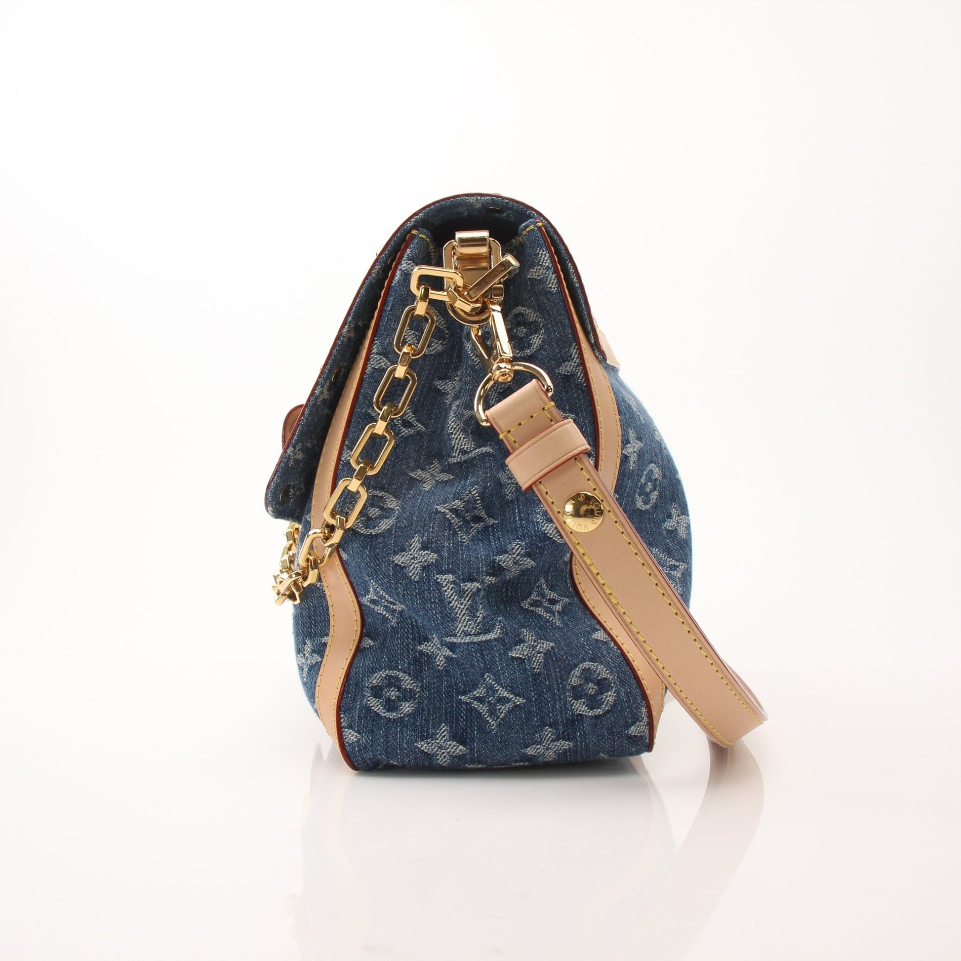 Louis Vuitton Dauphine GM shoulder handbag with gold hardware and structured design, featuring the iconic monogram canvas.