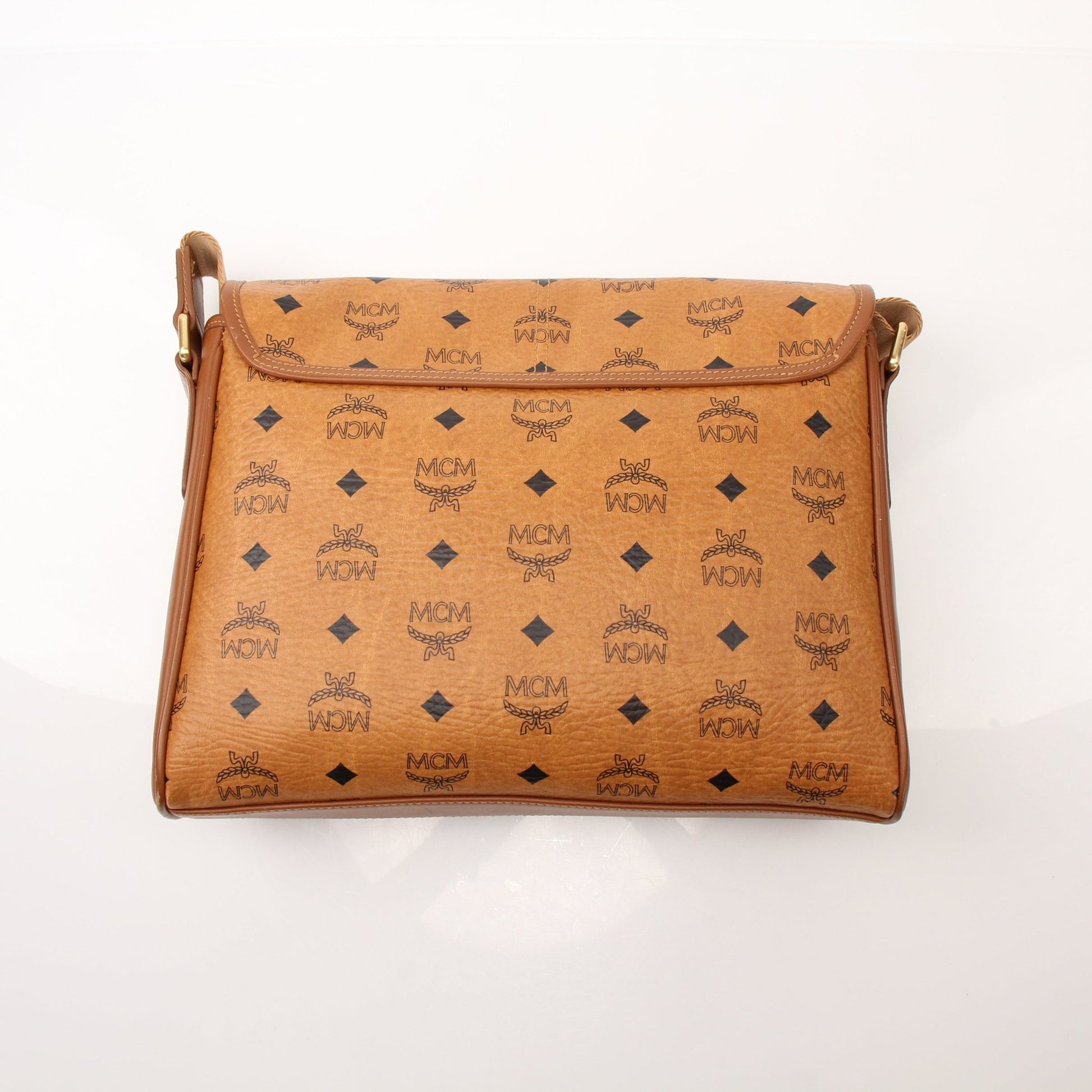 Gold & Beyond MCM Aren Messenger Bag, stylish handbag with adjustable strap and signature design, shown in the image.