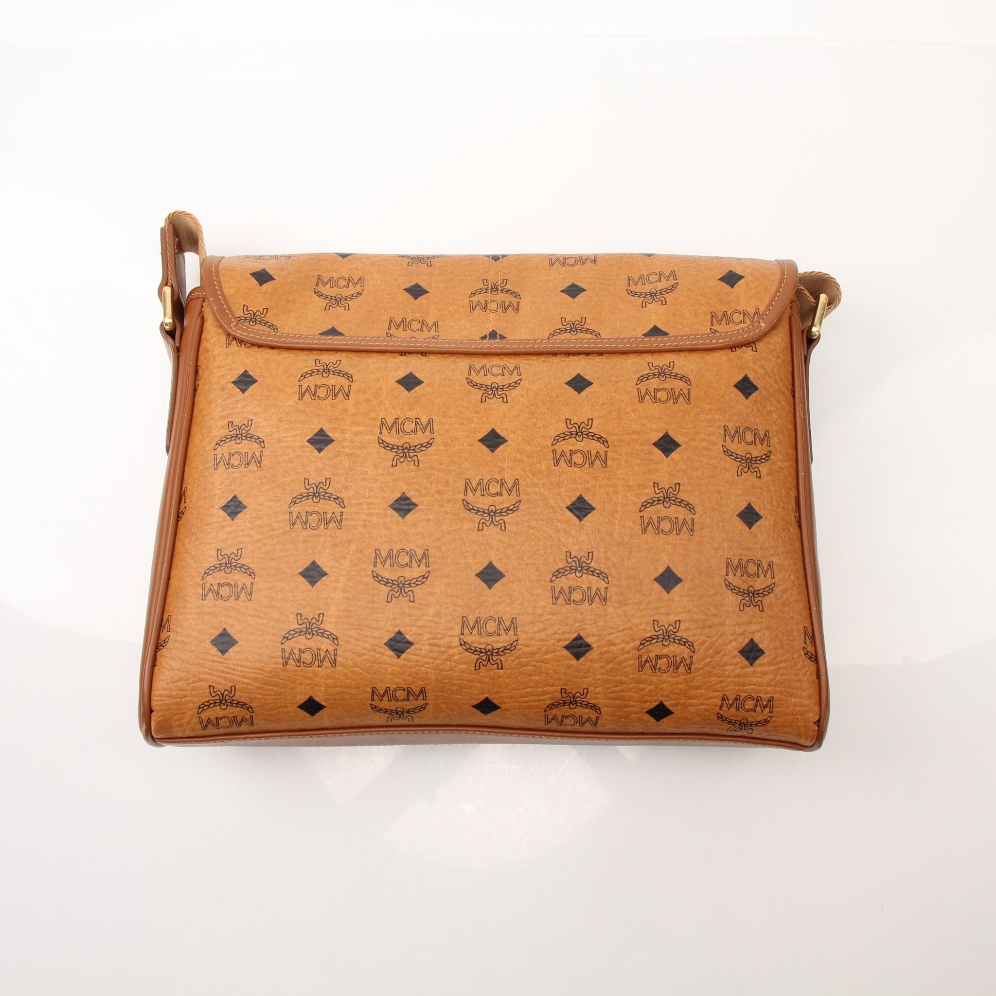 Gold & Beyond MCM Aren Messenger Bag, stylish handbag with adjustable strap and signature design, shown in the image.