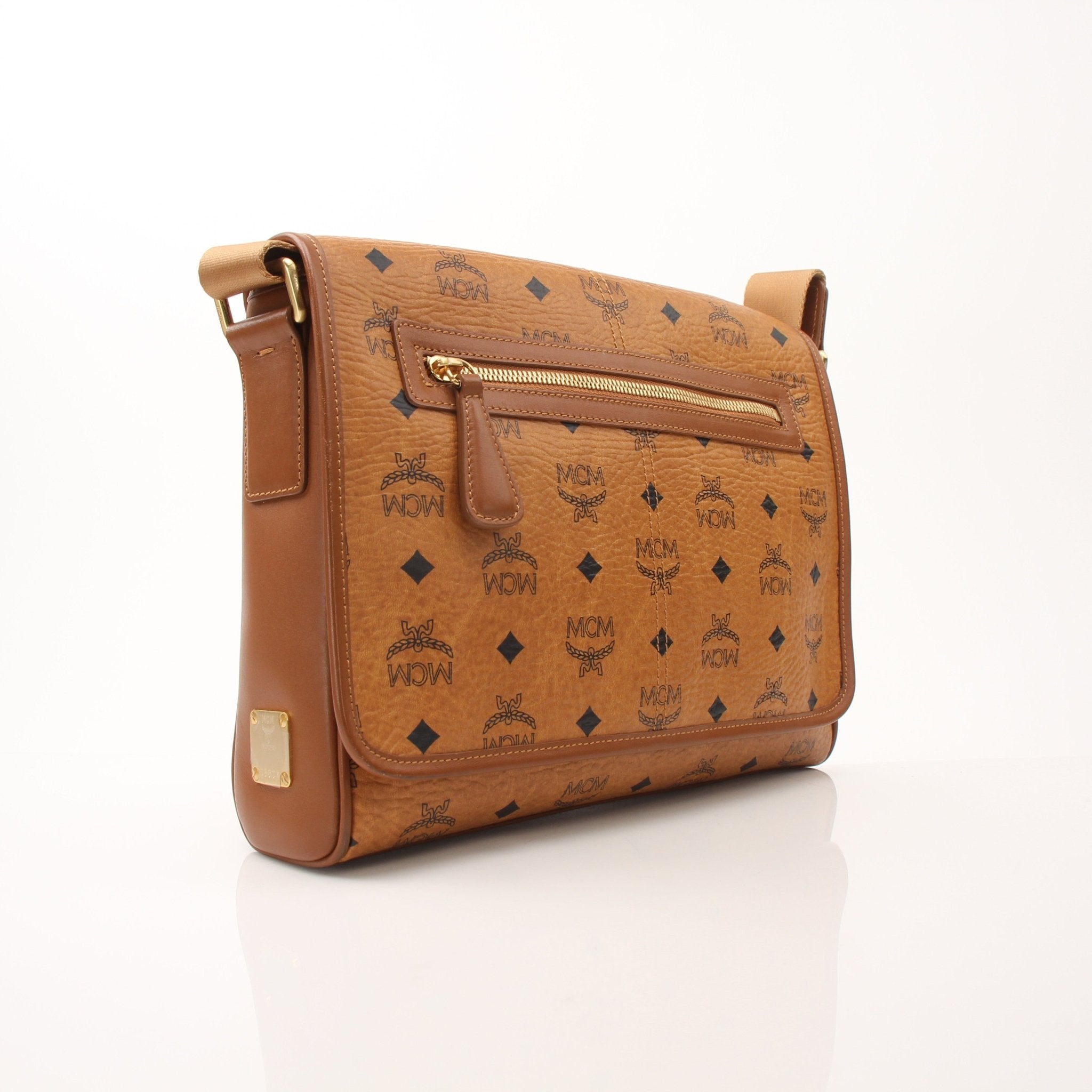 Gold & Beyond MCM Aren Messenger Bag handbag with tan leather and silver hardware, featuring adjustable strap and signature logo accents.