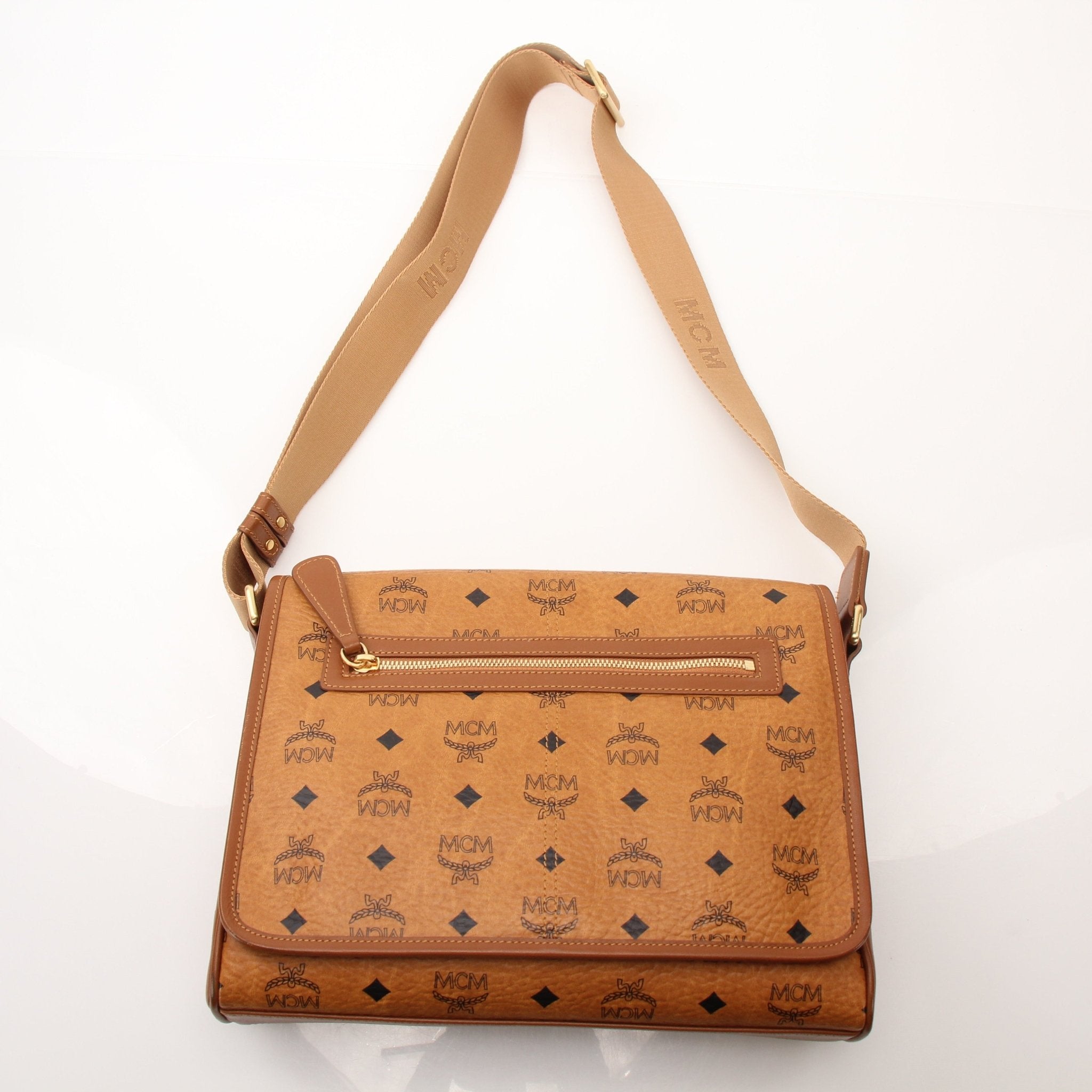 Gold & Beyond MCM Aren Messenger Bag, stylish handbag with leather strap and gold-tone hardware, displayed on a plain background.